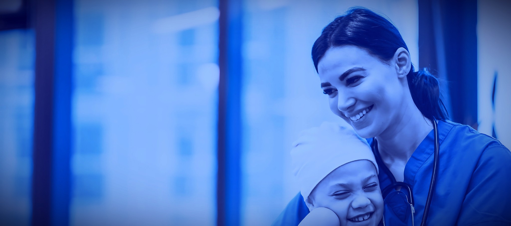 Aerial view of a doctor (HCP) taking care of an oncology patient.