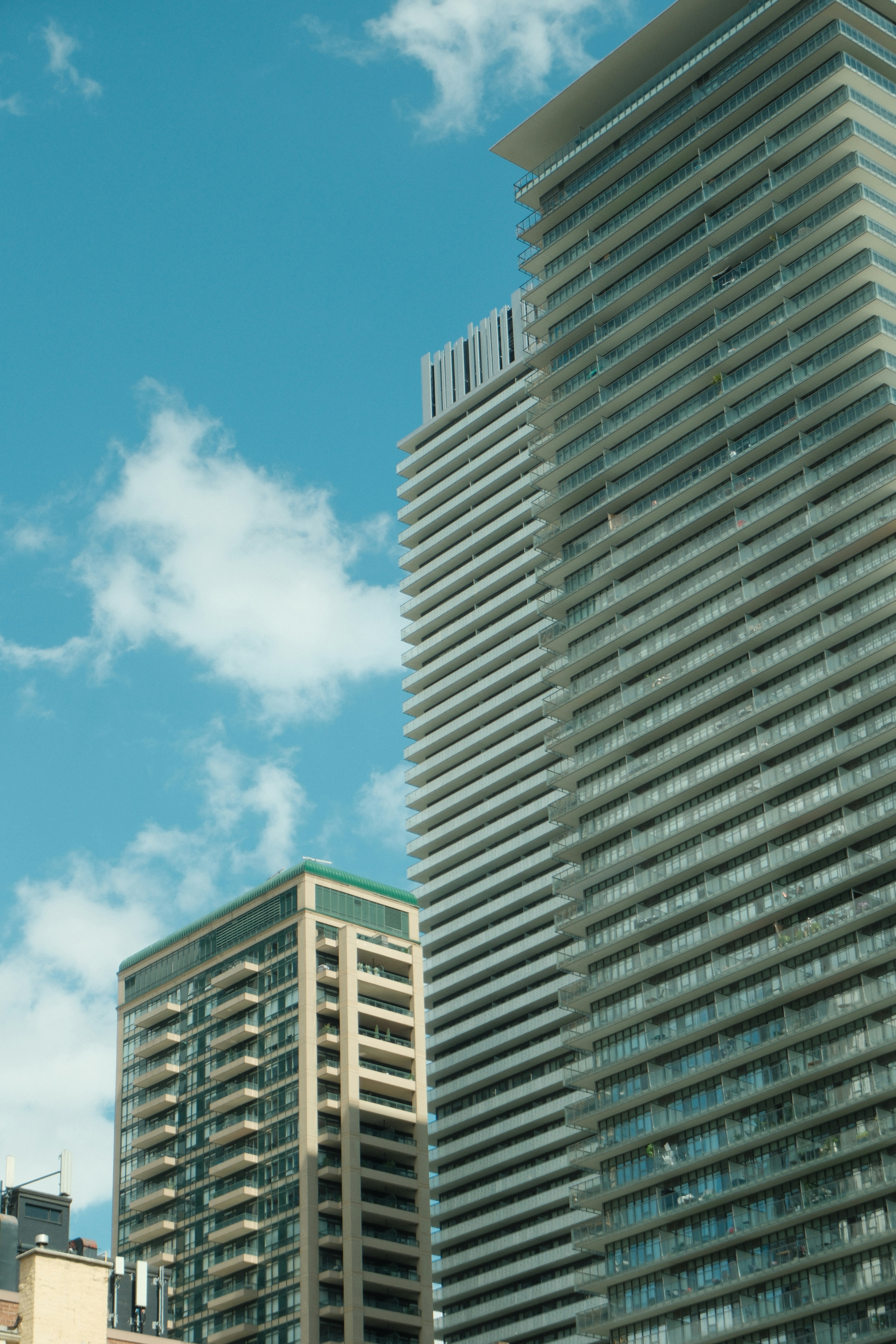 Modern skyscrapers against a bright blue sky
