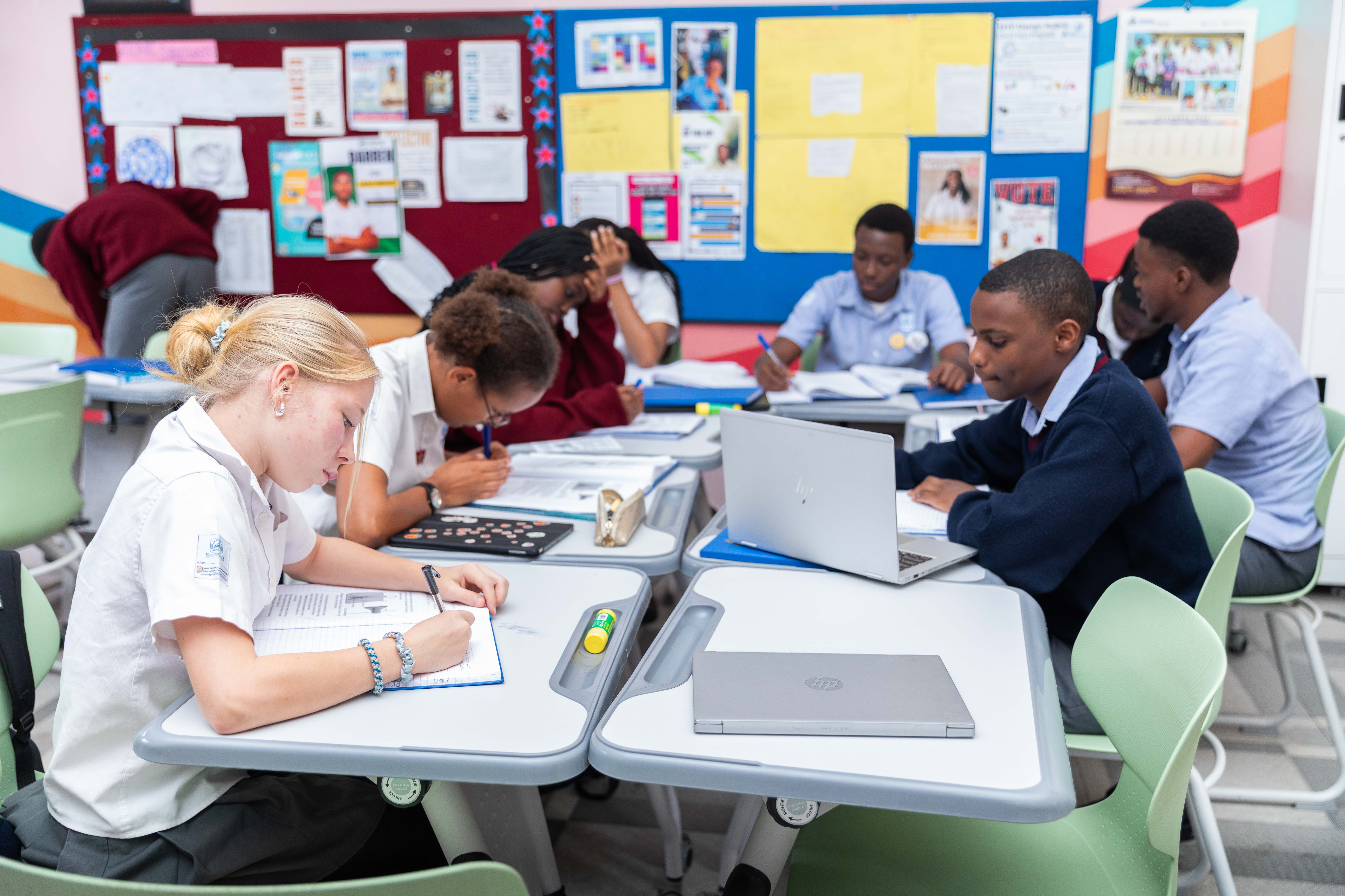 A school building stands against the backdrop of a clear sky