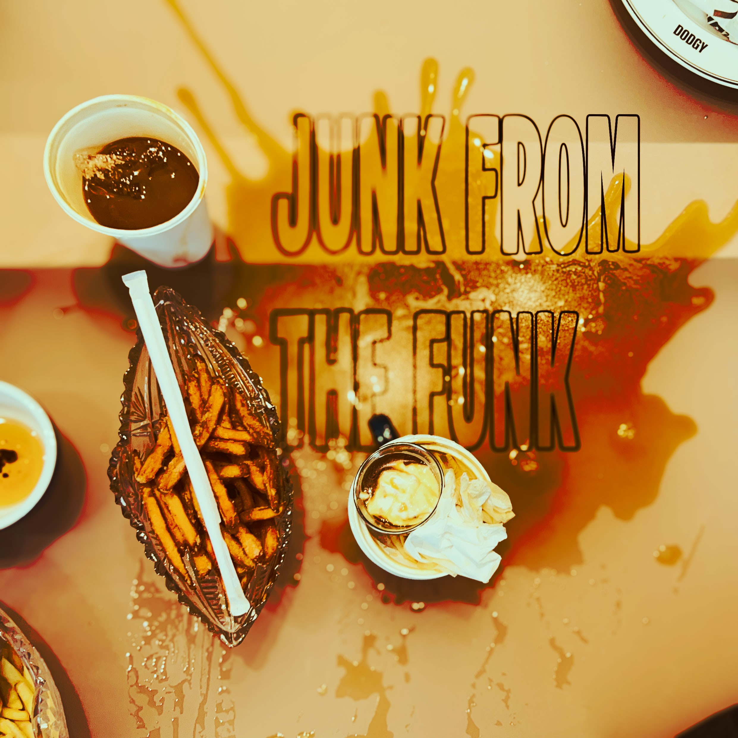 A woman in a light green suit sitting before a large circular opening that overlooks a calm, deep blue ocean.