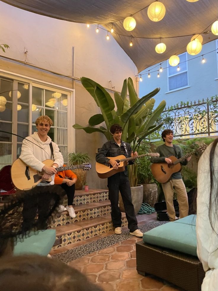 person playing brown and white electric guitar