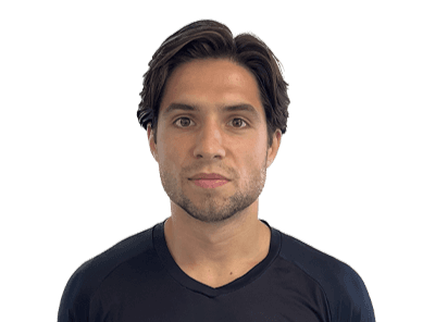 A thoughtful young person with dark hair gazes to the side, captured in soft black and white lighting.