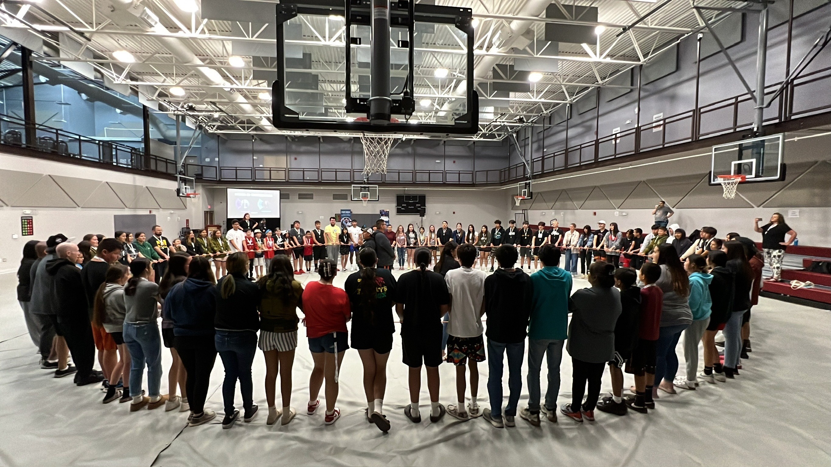a black and white living room with a large tv