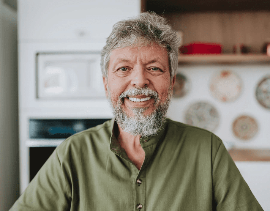 an older woman with white hair and a smile