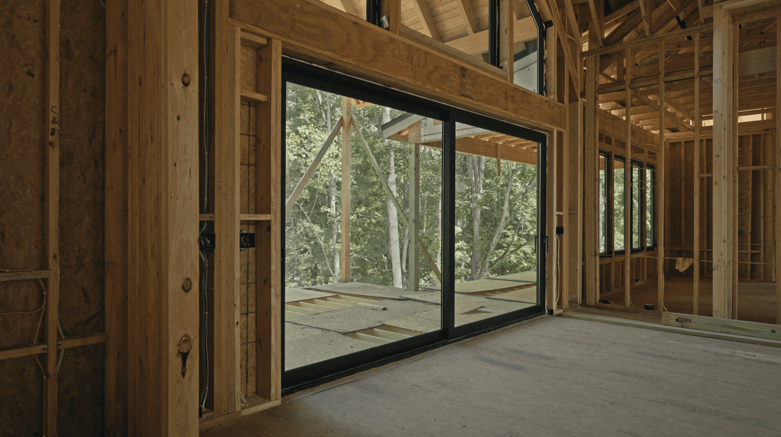 Large glazed door opening to the deck and woods