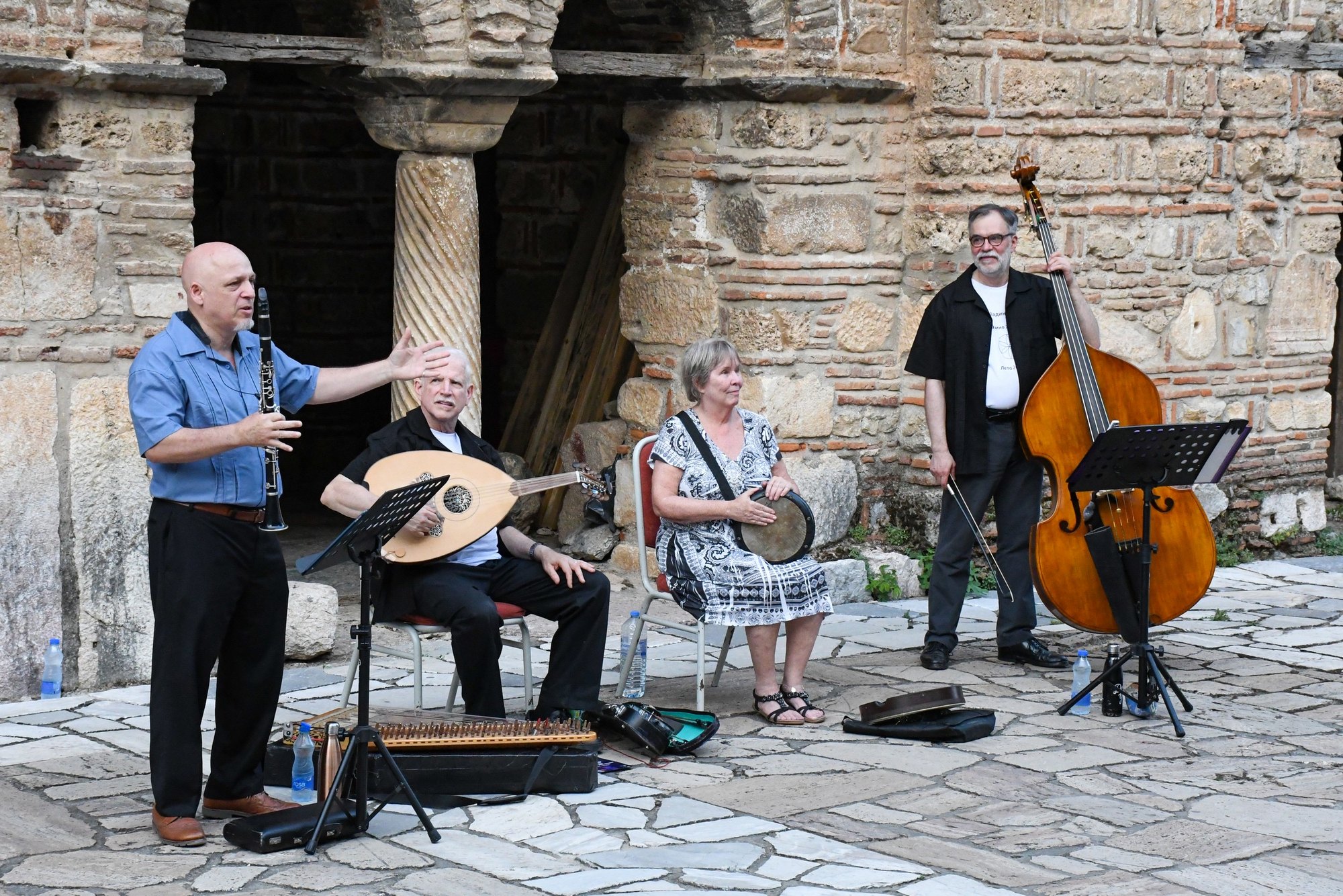Daniel Elias introducing a song in Ohrid, with the ensemble behind him