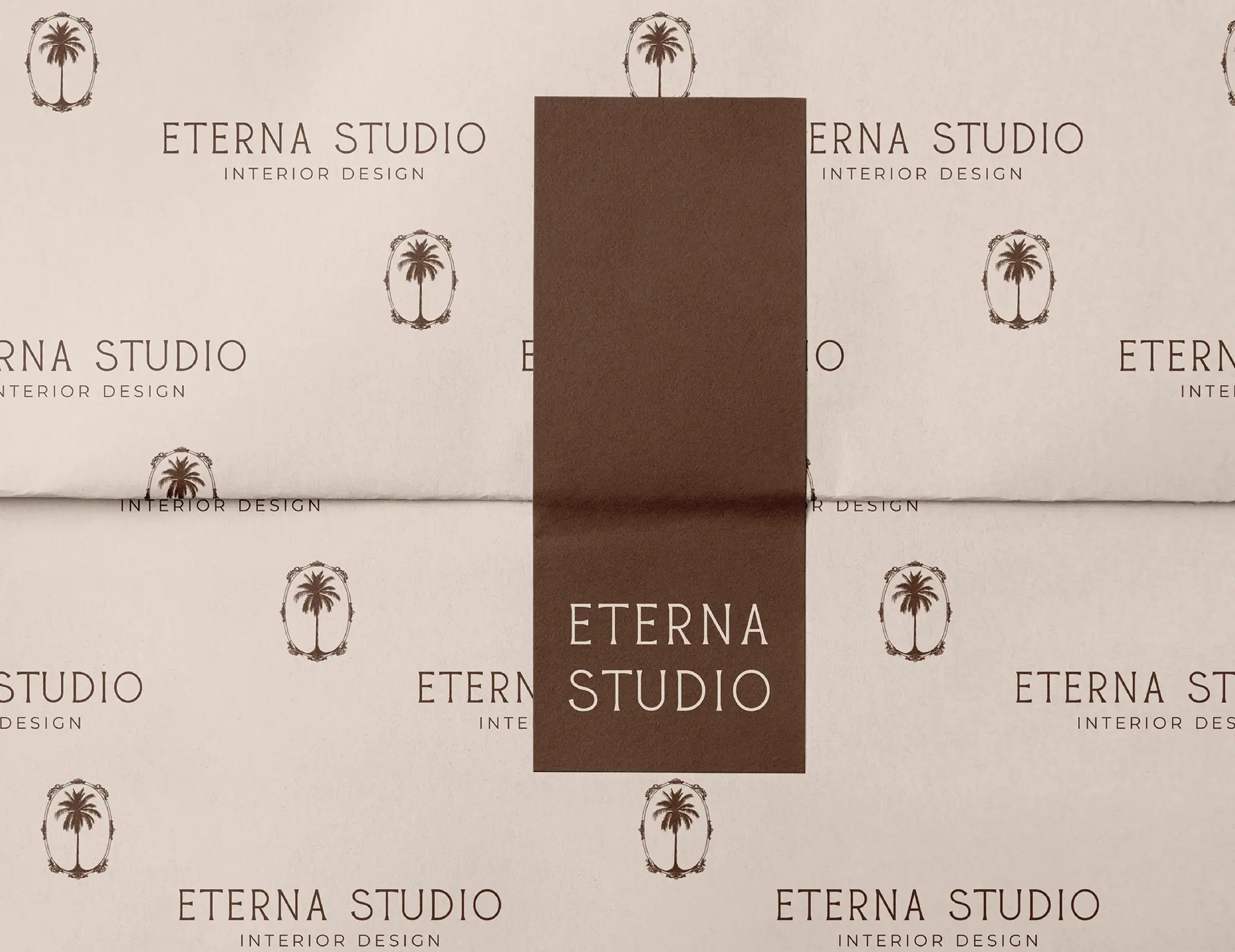Brand packaging and tissue paper design for Eterna Studio interior design showing branded pattern and collateral