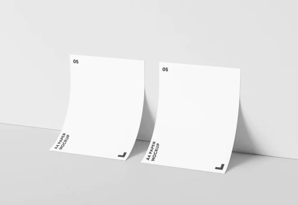Two A4-sized sheets of paper standing upright against a light gray background. The clean design highlights the minimalistic layout and smooth texture of the paper.