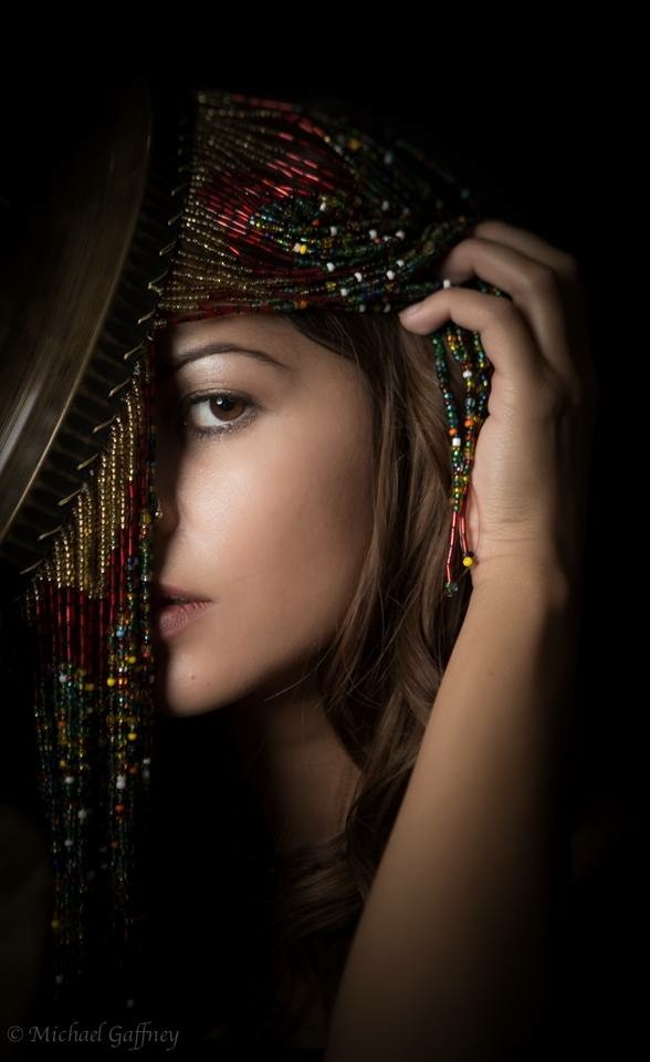 face peaking through beads