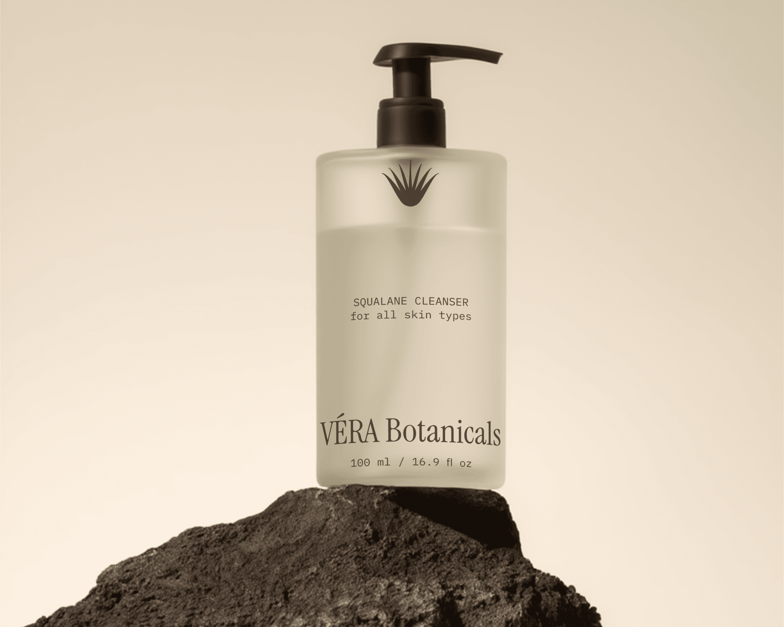 A packaging bottle design for the organic skincare brand VÉRA Botanicals. The bottle features a frosted glass finish and a simple design.