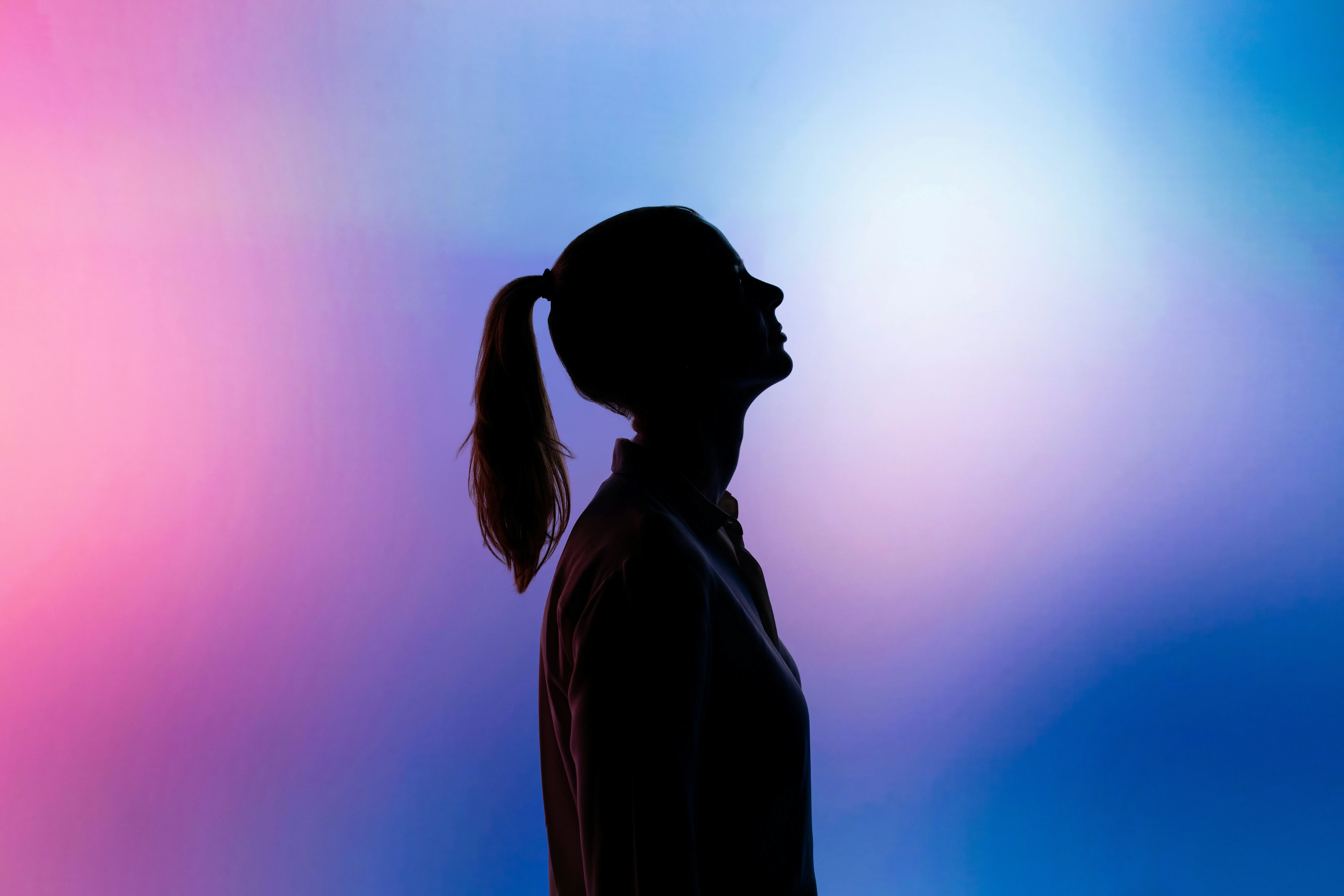 This image illustrates the growing phenomenon of AI anxiety—the fear, worry, and uncertainty people may feel about the rapid advancement of artificial intelligence. The silhouette facing upward reflects contemplation, concern, and adaptation during a time of significant technological change. As AI continues to reshape industries, employment, creativity, privacy, and society, many individuals experience stress about job security, loss of control, information overload, and the future of human value. This visual accompanies therapist-guided strategies for managing AI anxiety through self-awareness, emotional acceptance, mental health practices, human connection, and healthy engagement with emerging technology.