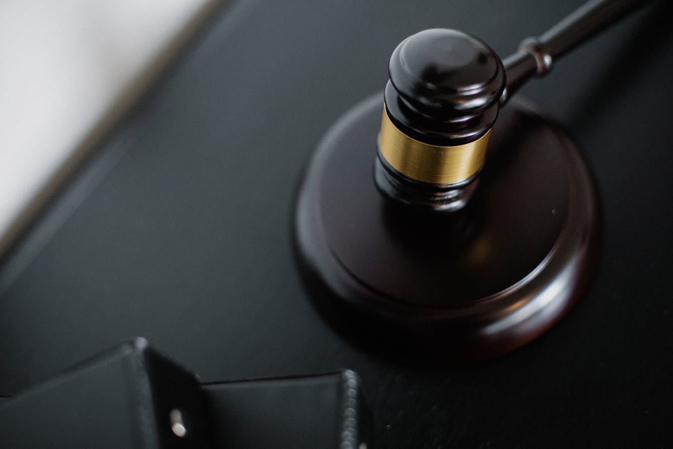 Judge’s gavel on a black desk