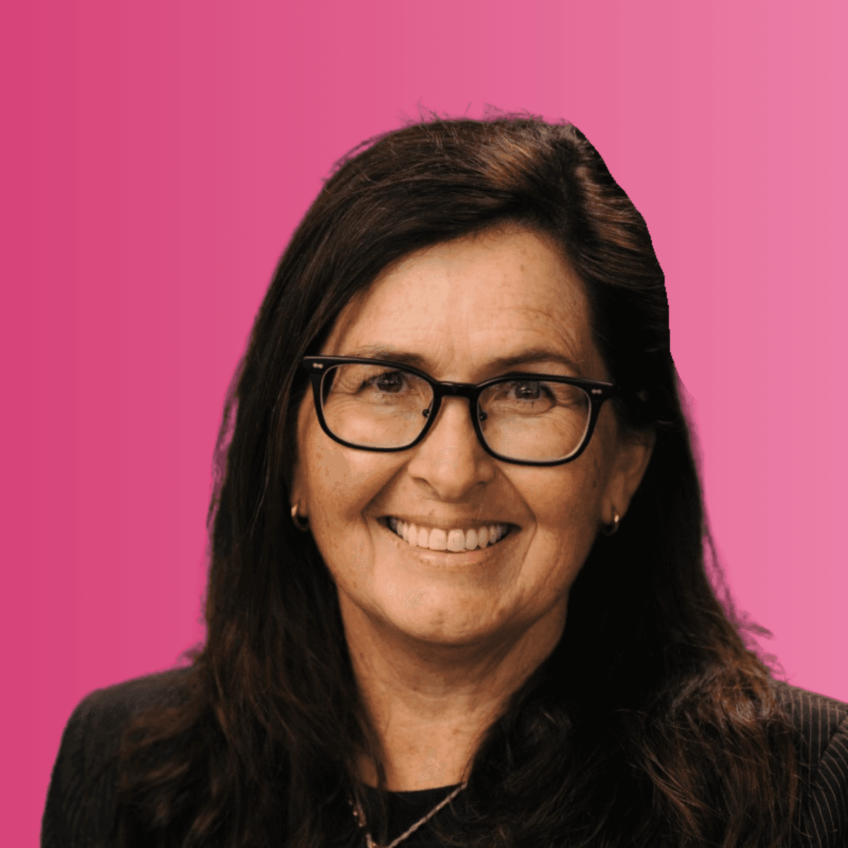 a person sitting at a desk with a laptop