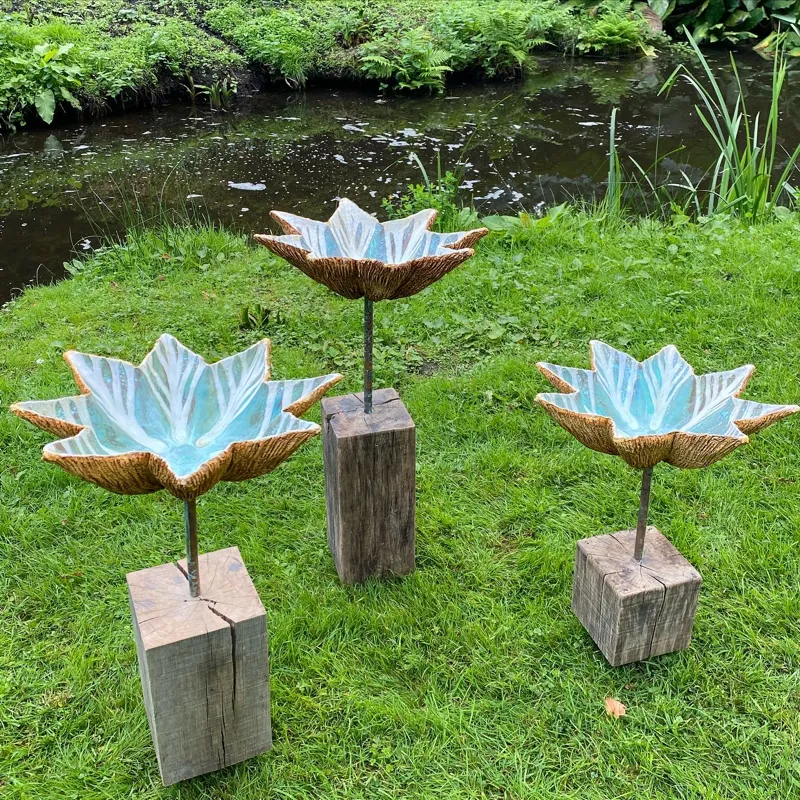 group of precipitor sculptures next to stream