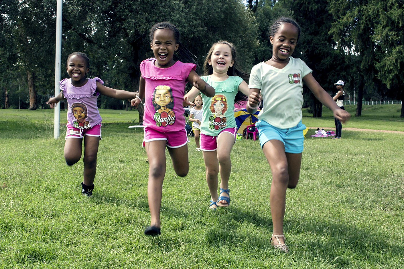 Kids running wearing KN Studios Merchandise