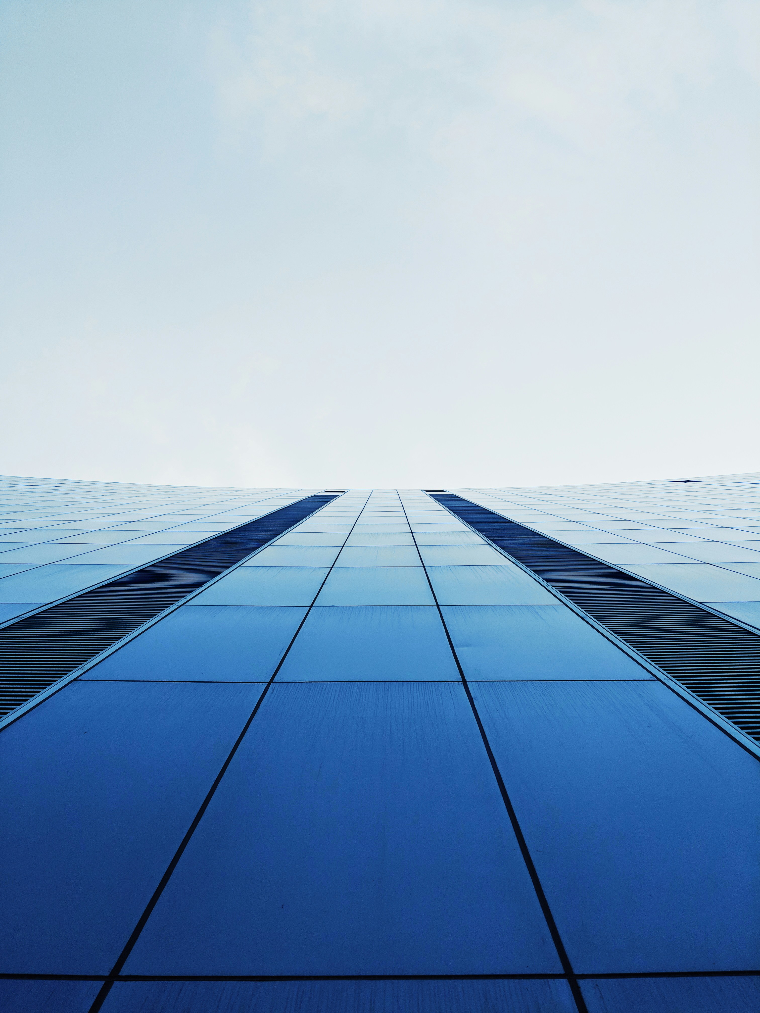 worms eye view photography of black building