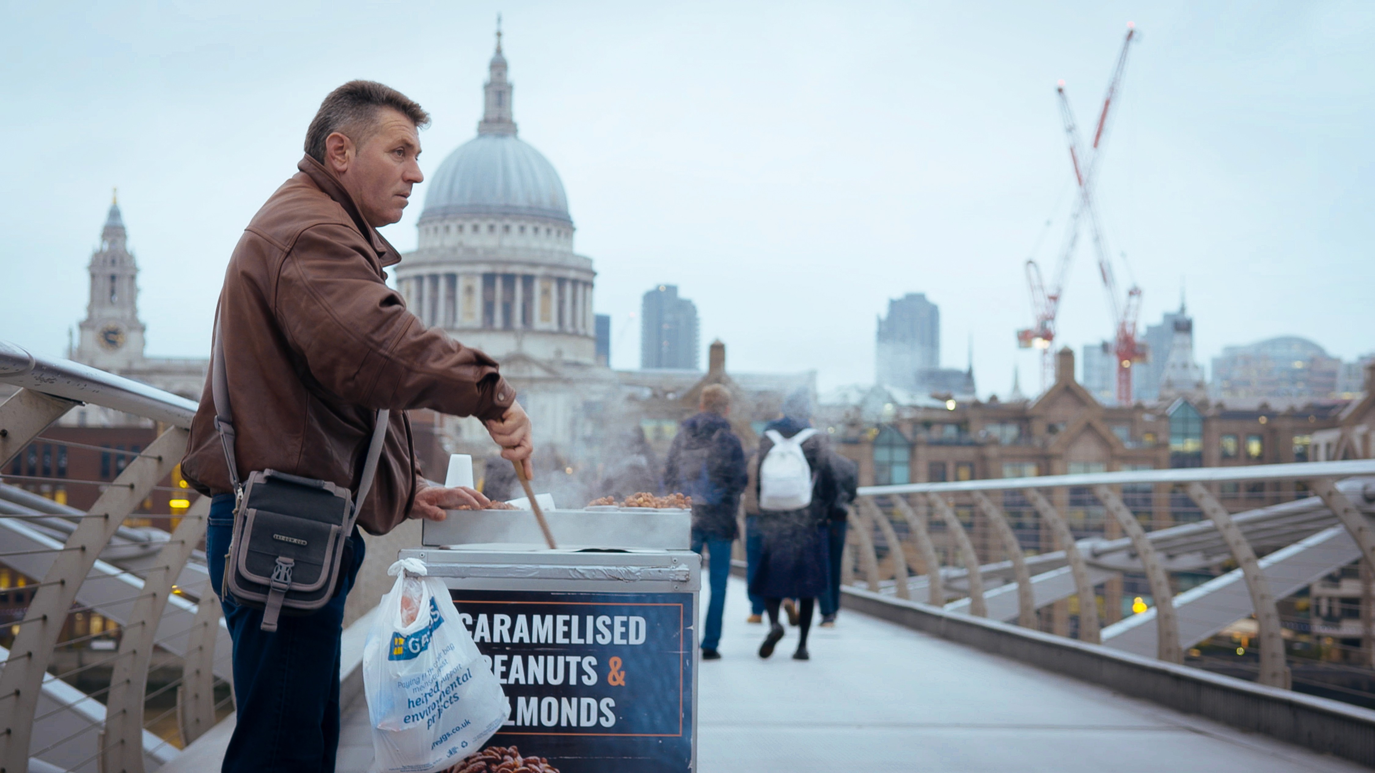 Soft-focus portrait of a woman partially obscured by the delicate shadows of foliage.