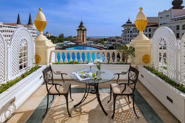 A private balcony or terrace extends the space, bringing light, air, and calm into the room.