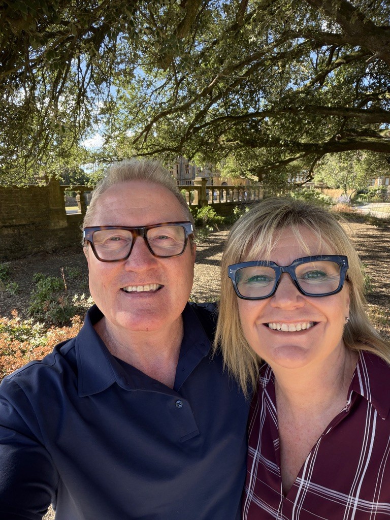 Brian and Janice Muldoon, co-founders of XLRevenue, smiling together outdoors