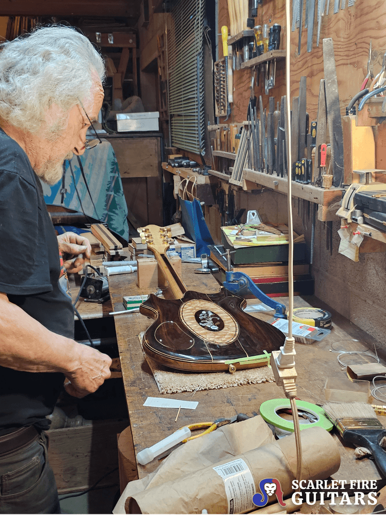 Doug Irwin with Jerry Garcia's Tiger guitar in his shop