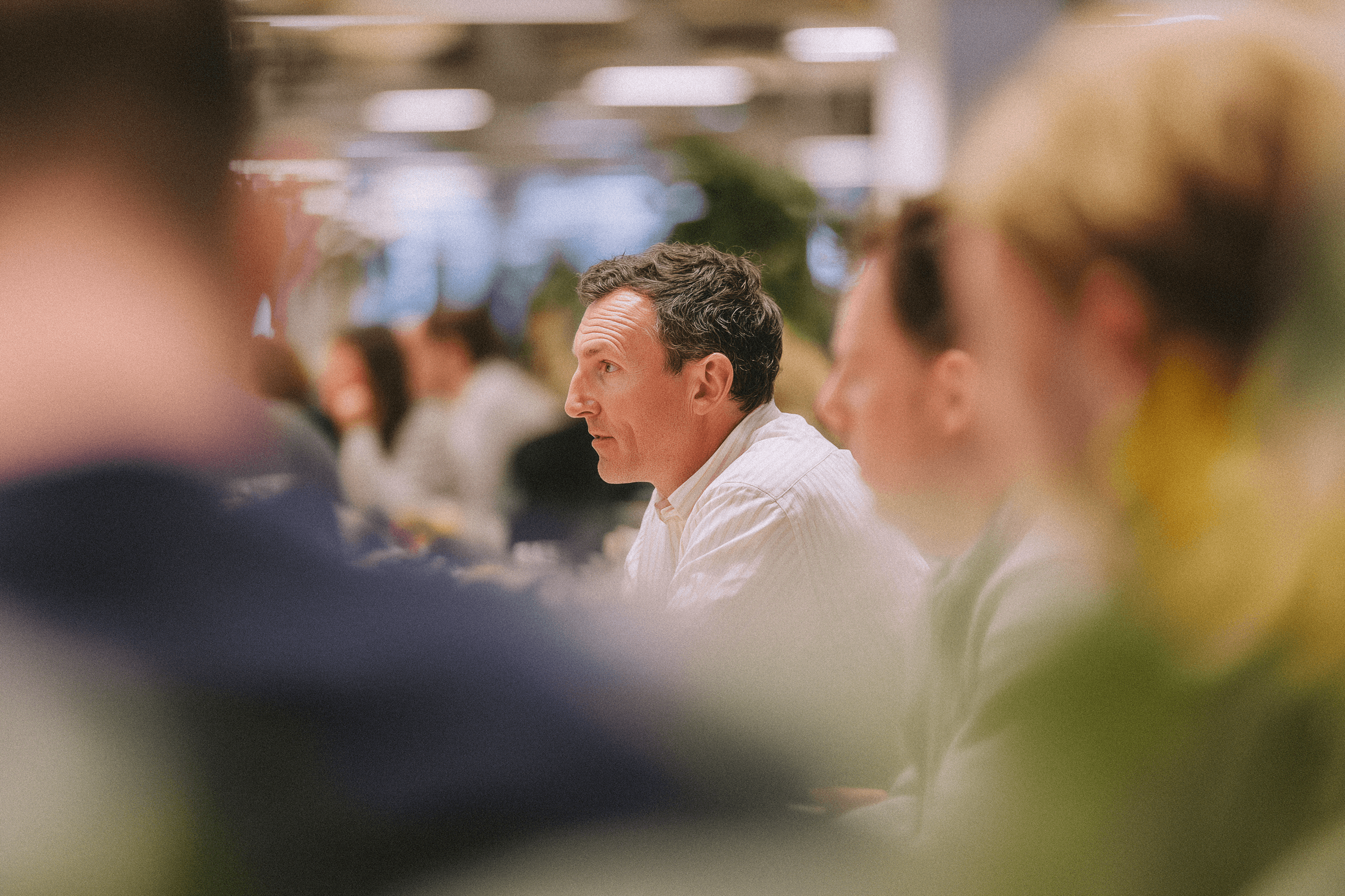Team working in an office watching at a presentation