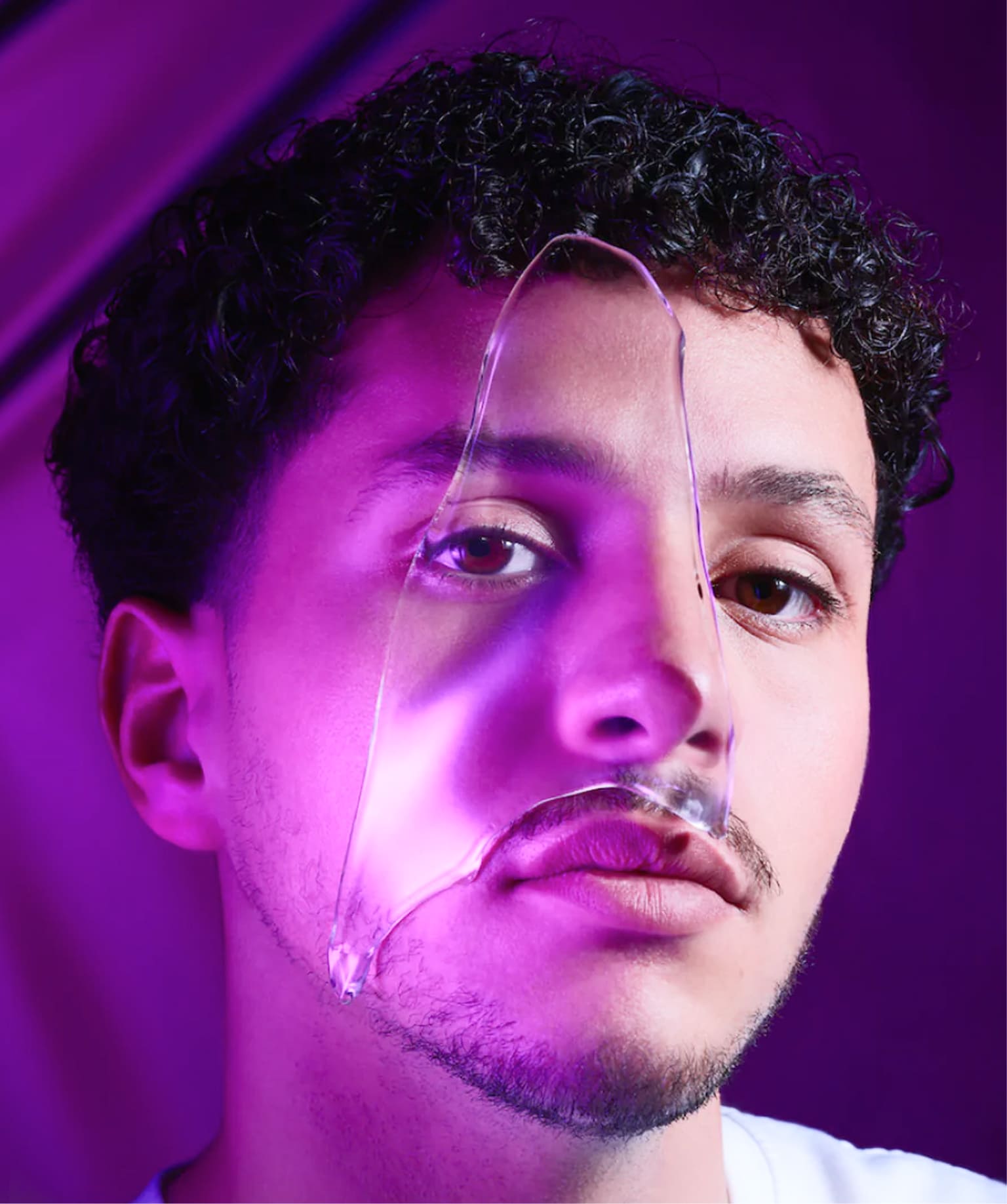 Male beauty portrait with liquid texture overlay highlighting skincare innovation and I.D. Swiss Botanicals campaign identity