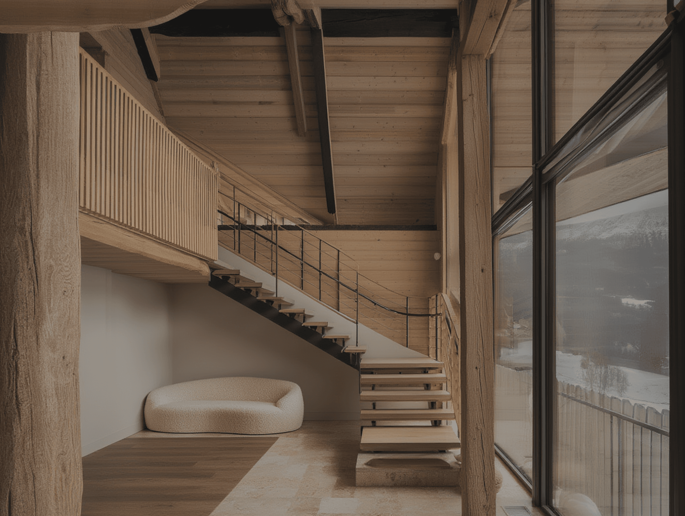 Timber staircase inside an alpine retreat with exposed beam ceiling