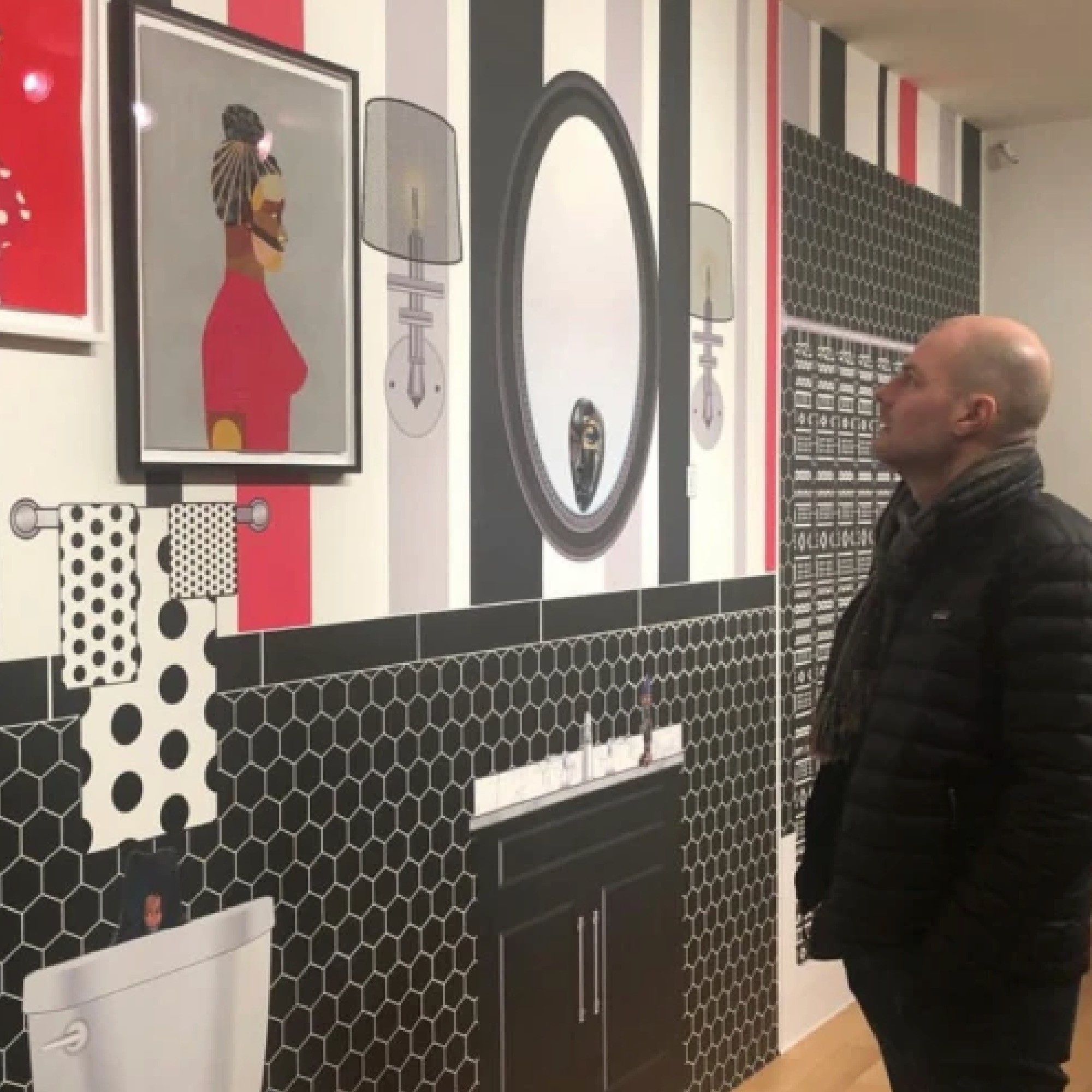 Rob Hartnett looking at installed mural at the Luxembourg and Dayan gallery.