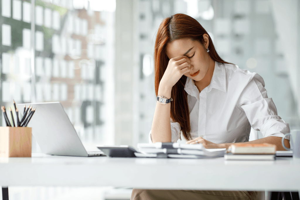 Tech worker stressed out at desk