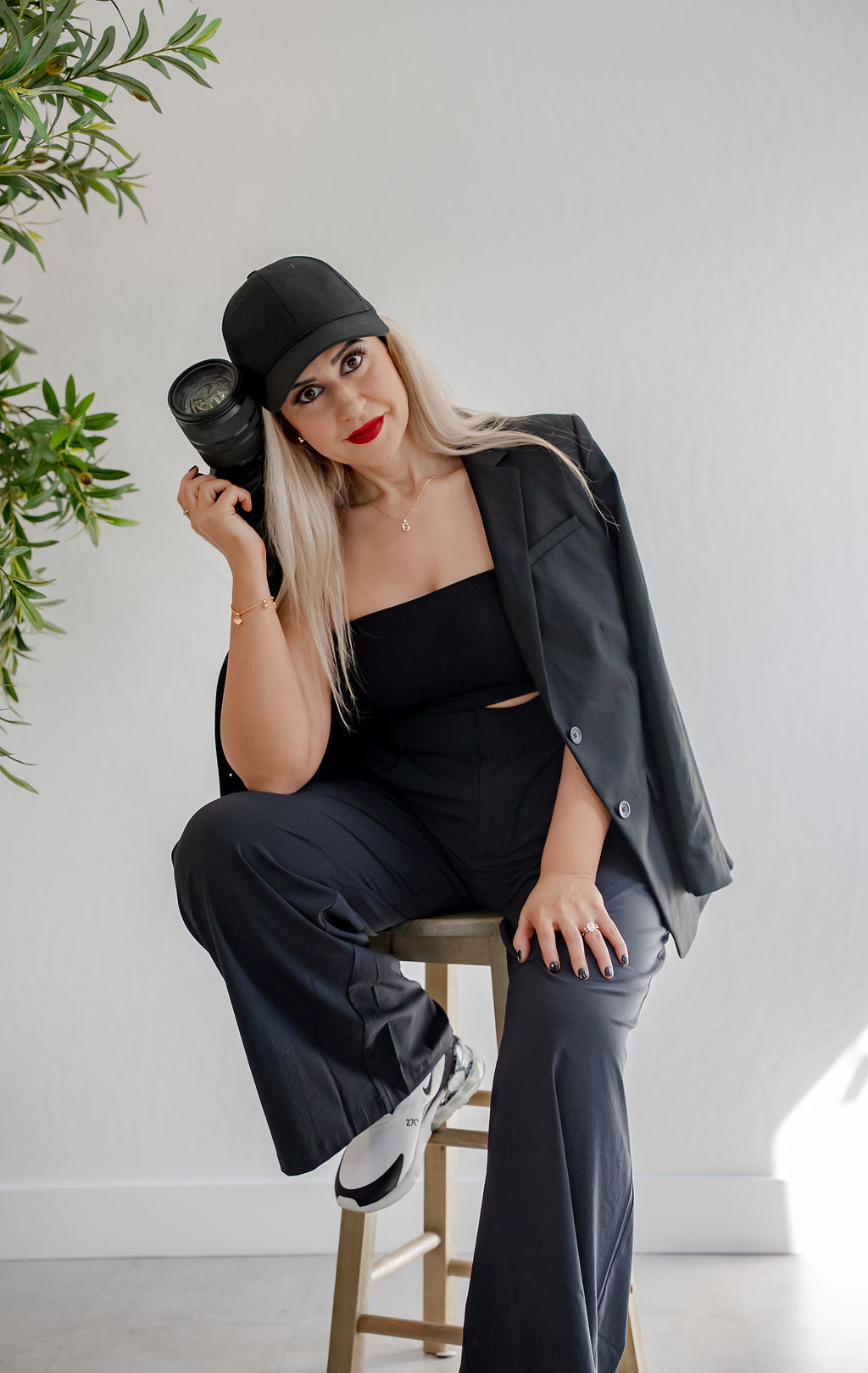 A couple embraces lovingly on a wooden dock.