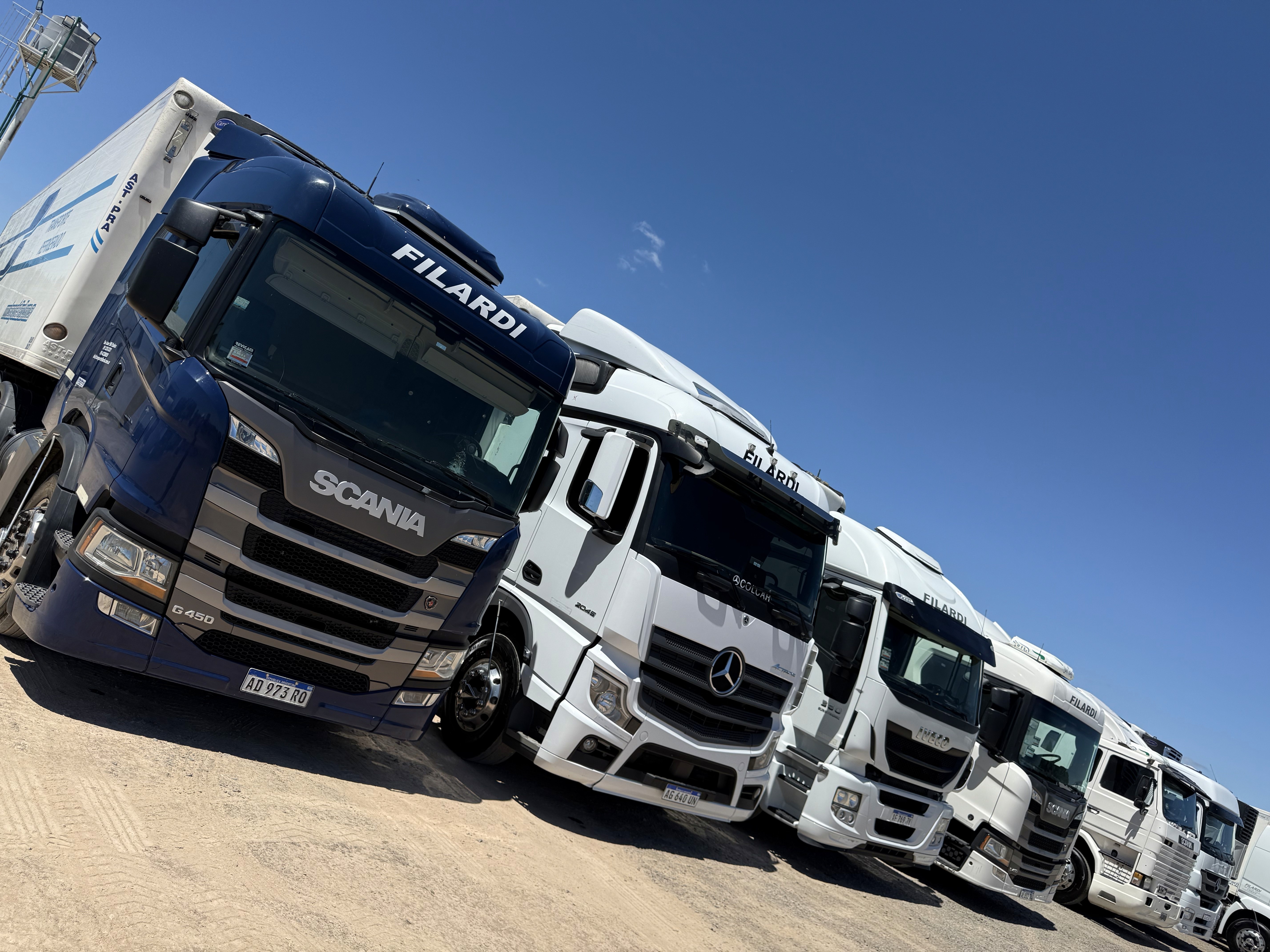 two people looking at a tablet and smiling