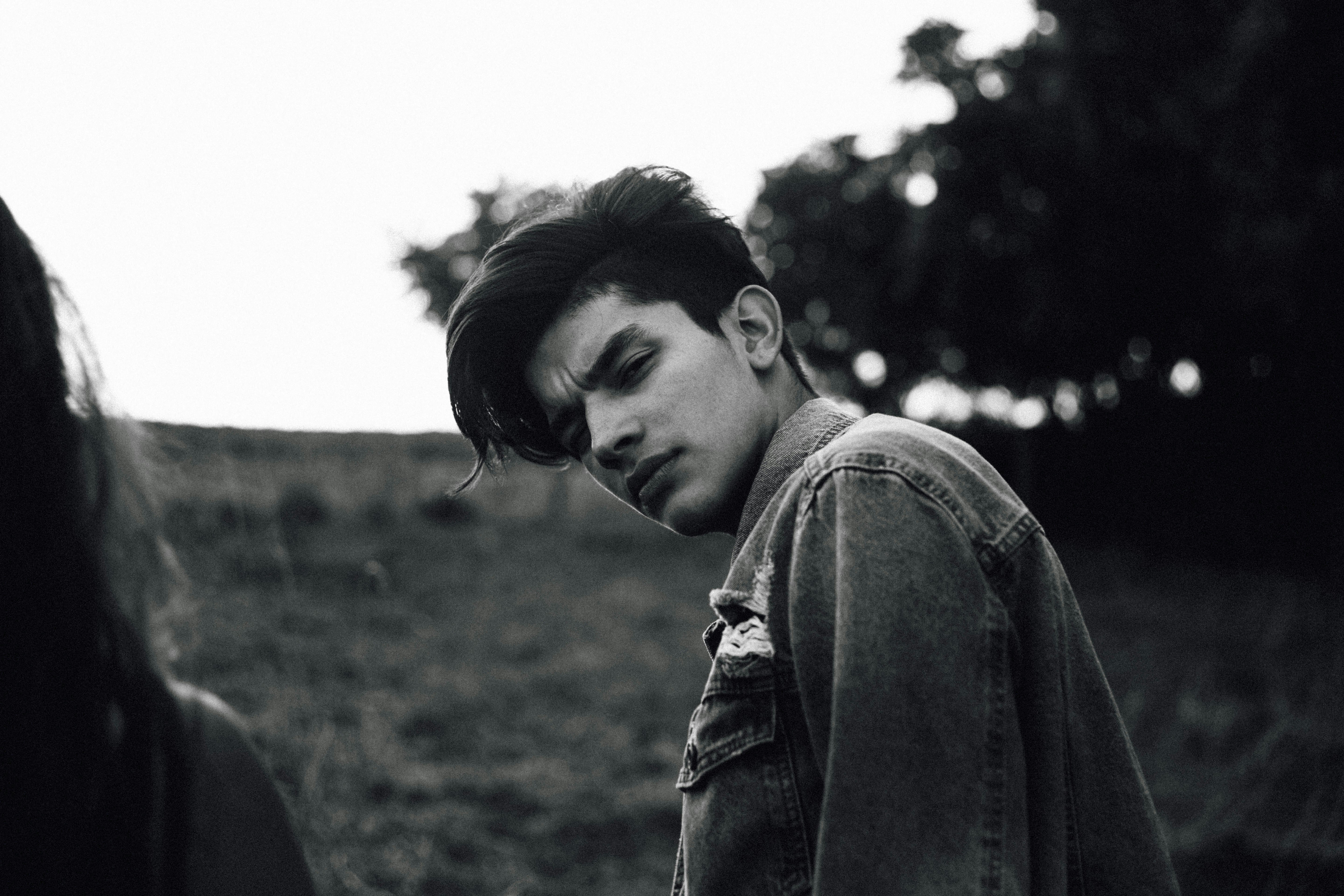 man posing with his hair style - mewing meaning