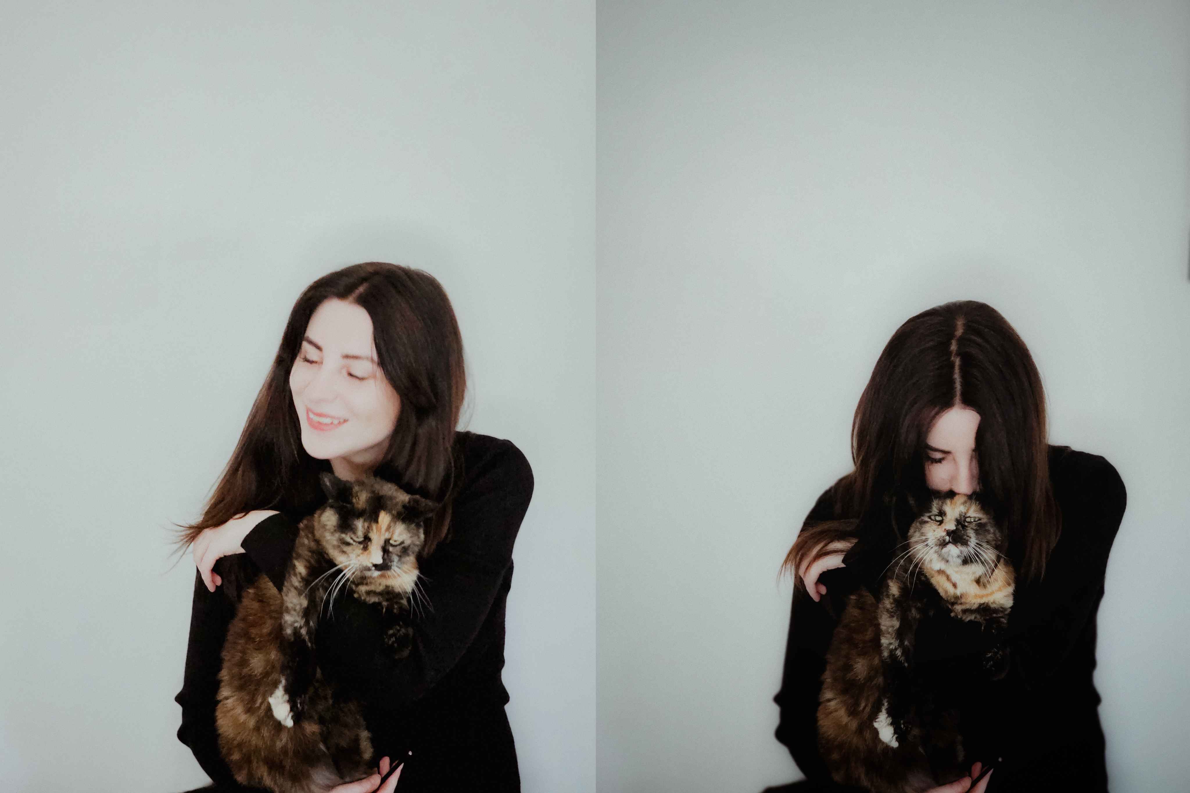 Woman hugs a cat