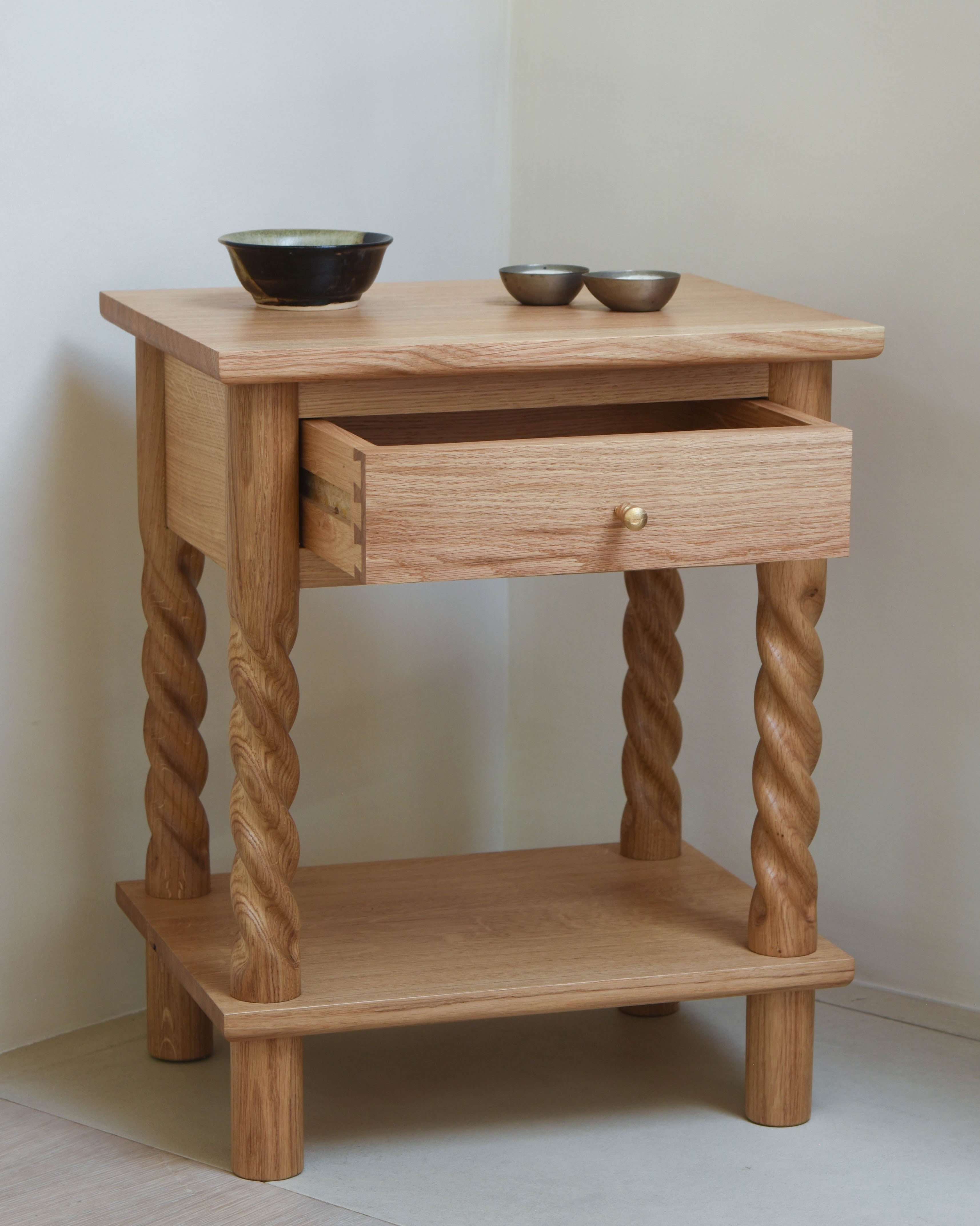 99 Bedside Table in oak with drawer against plaster wall