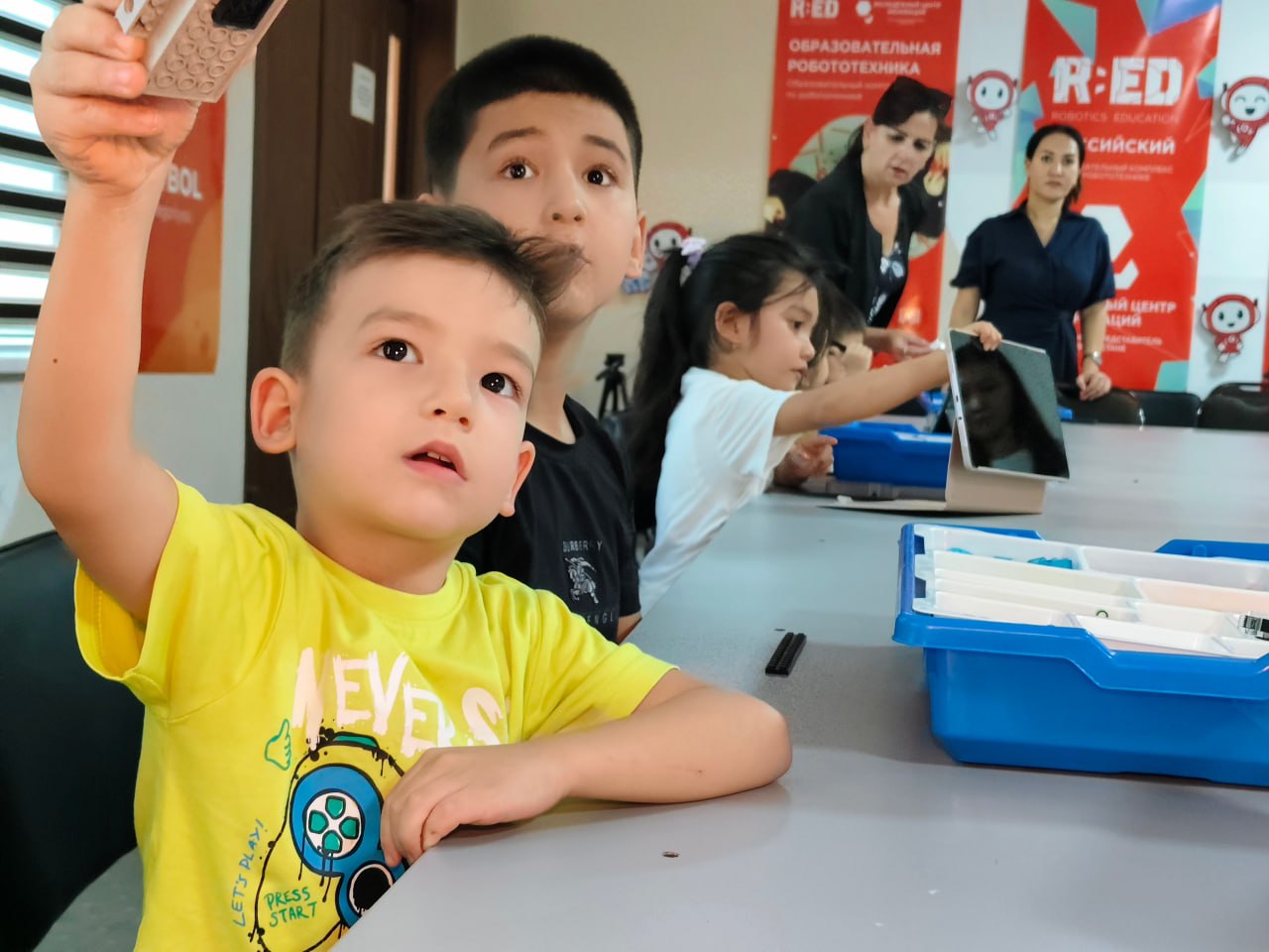 A man stading with Surfboard