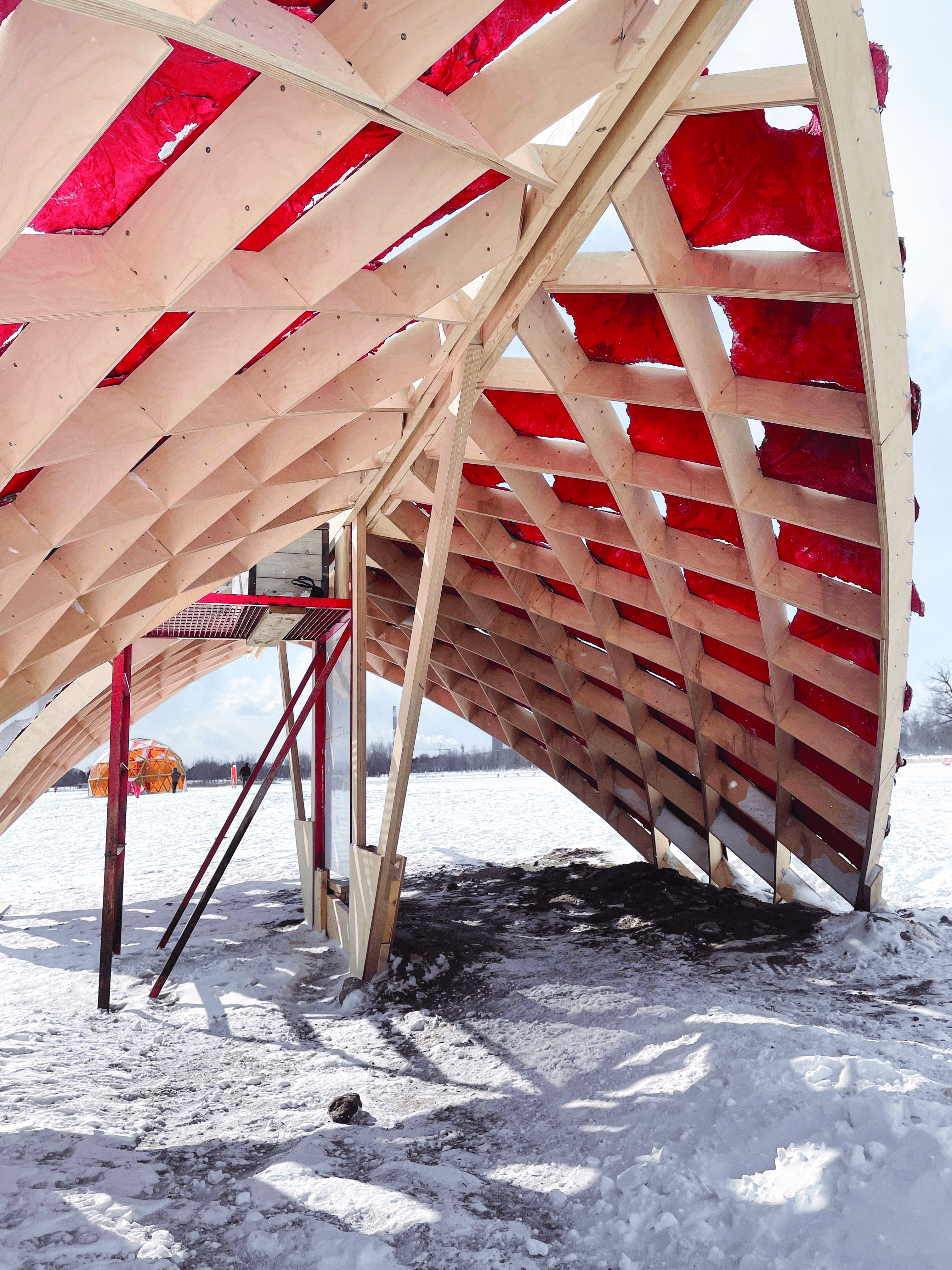 Interior perspective showing the red painted concrete panels.