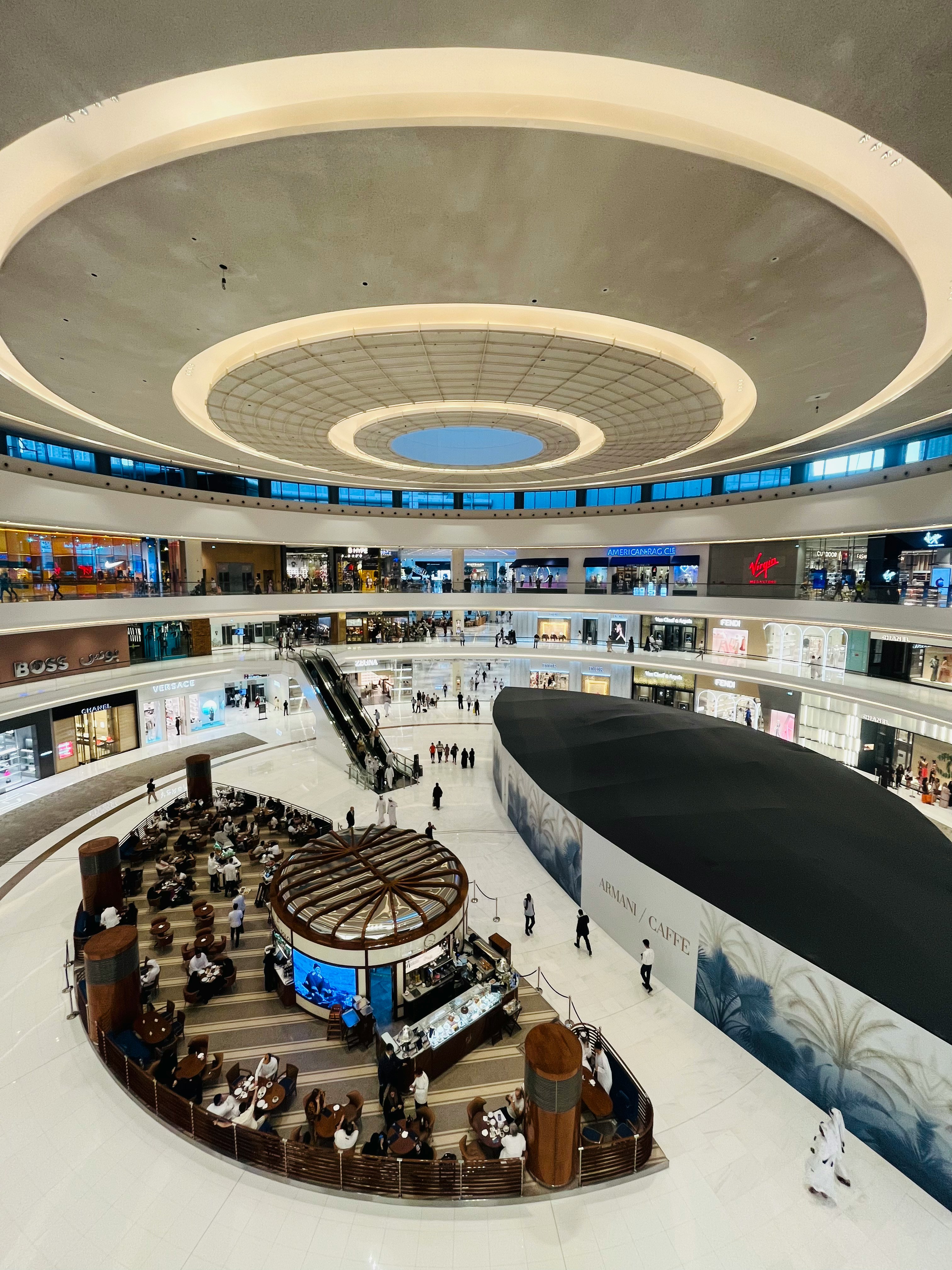 a large building with people walking around inside of it