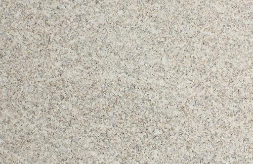 Close-up of a polished light beige granite tile with smooth surface texture.