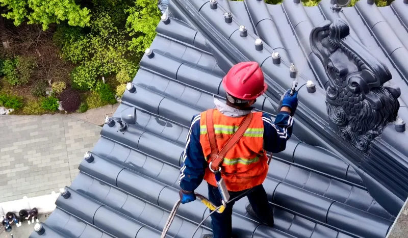men working on a roof