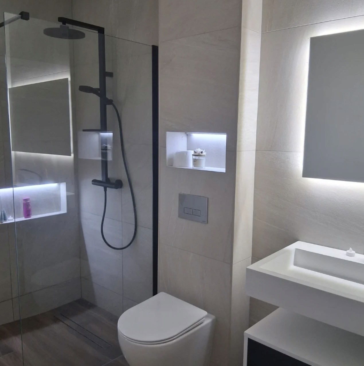 a bathroom with a large mirror