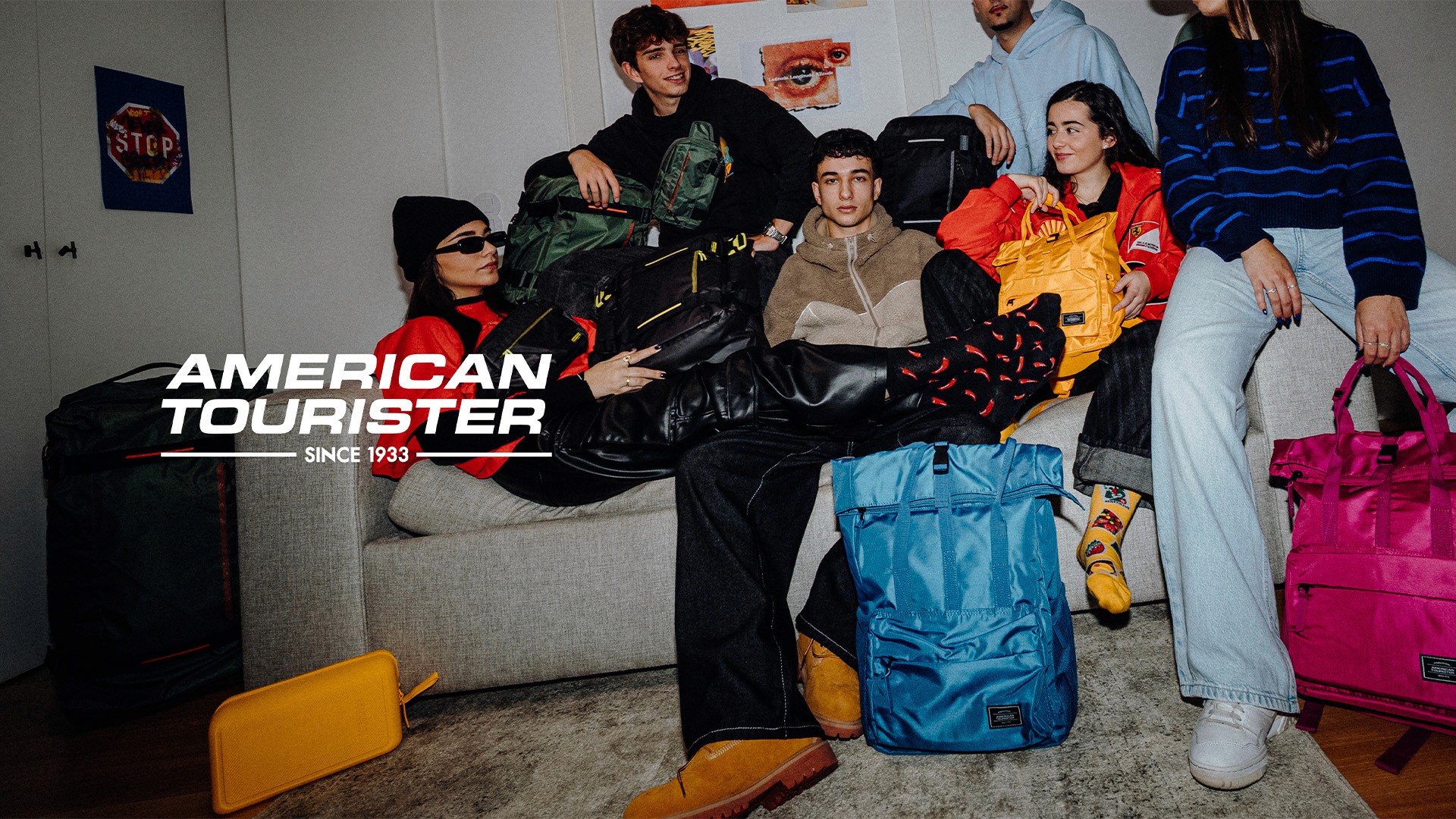 American Tourister teens sitting on a couch with colorful backpacks