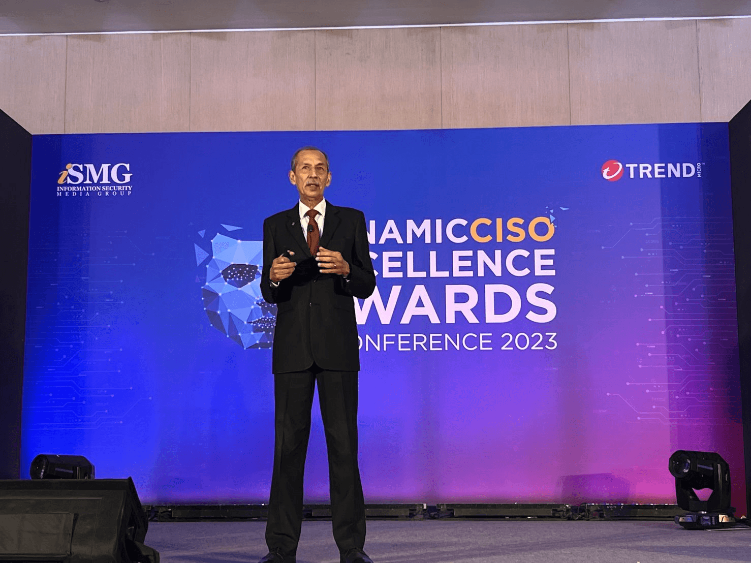 Barbed wire fence along a dry, overgrown path.