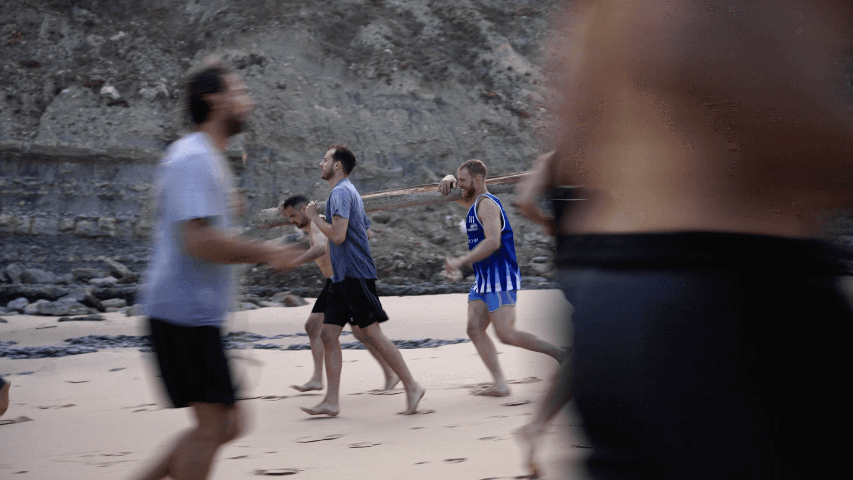 Men doing a workout on the beach