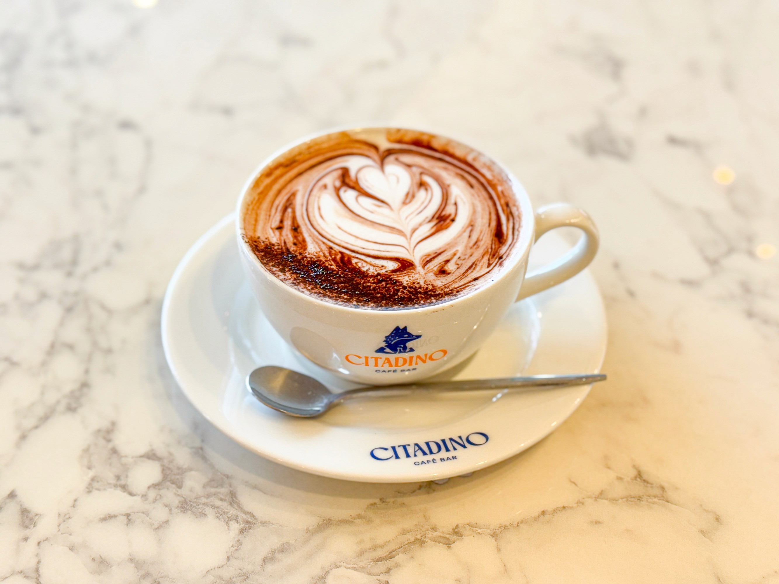 focus photography of coffee artwork