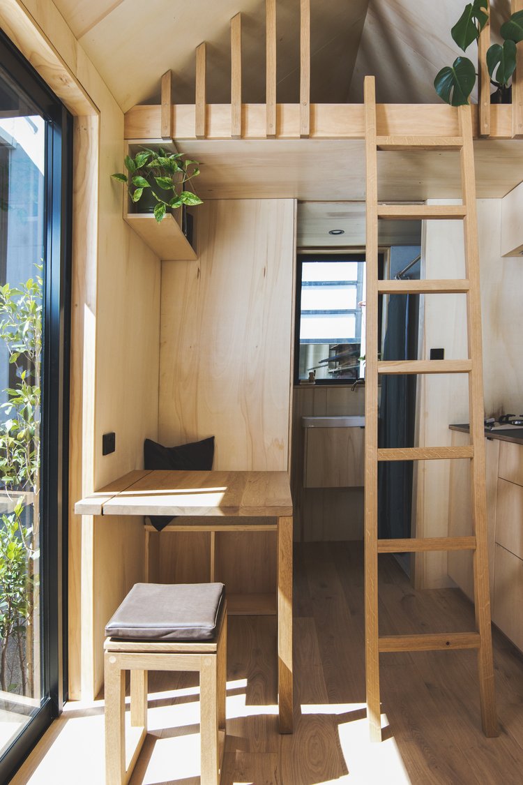 Space-saving timber cabin interior by Made By Hideaway