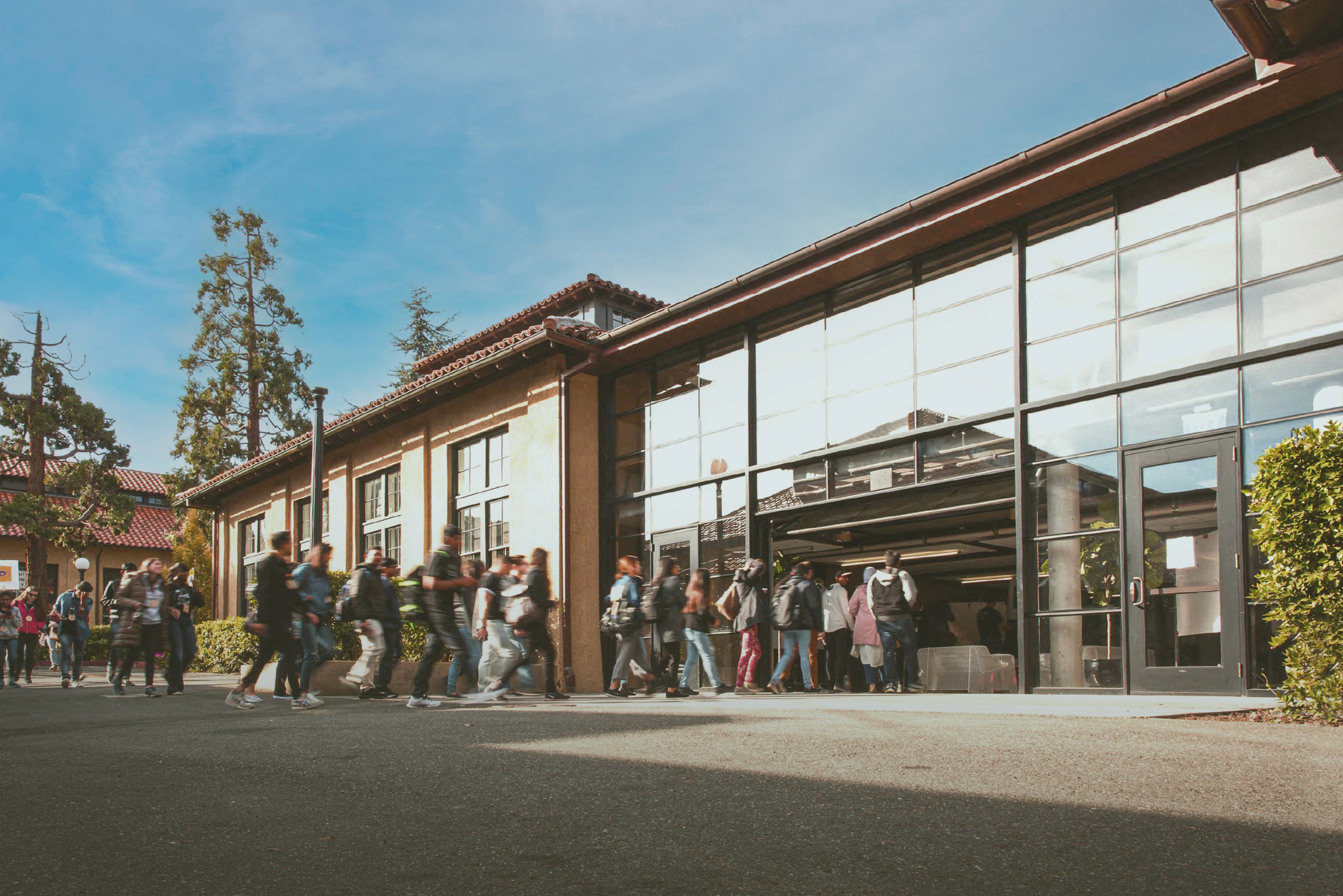 Stanford d.school building with students walking in.