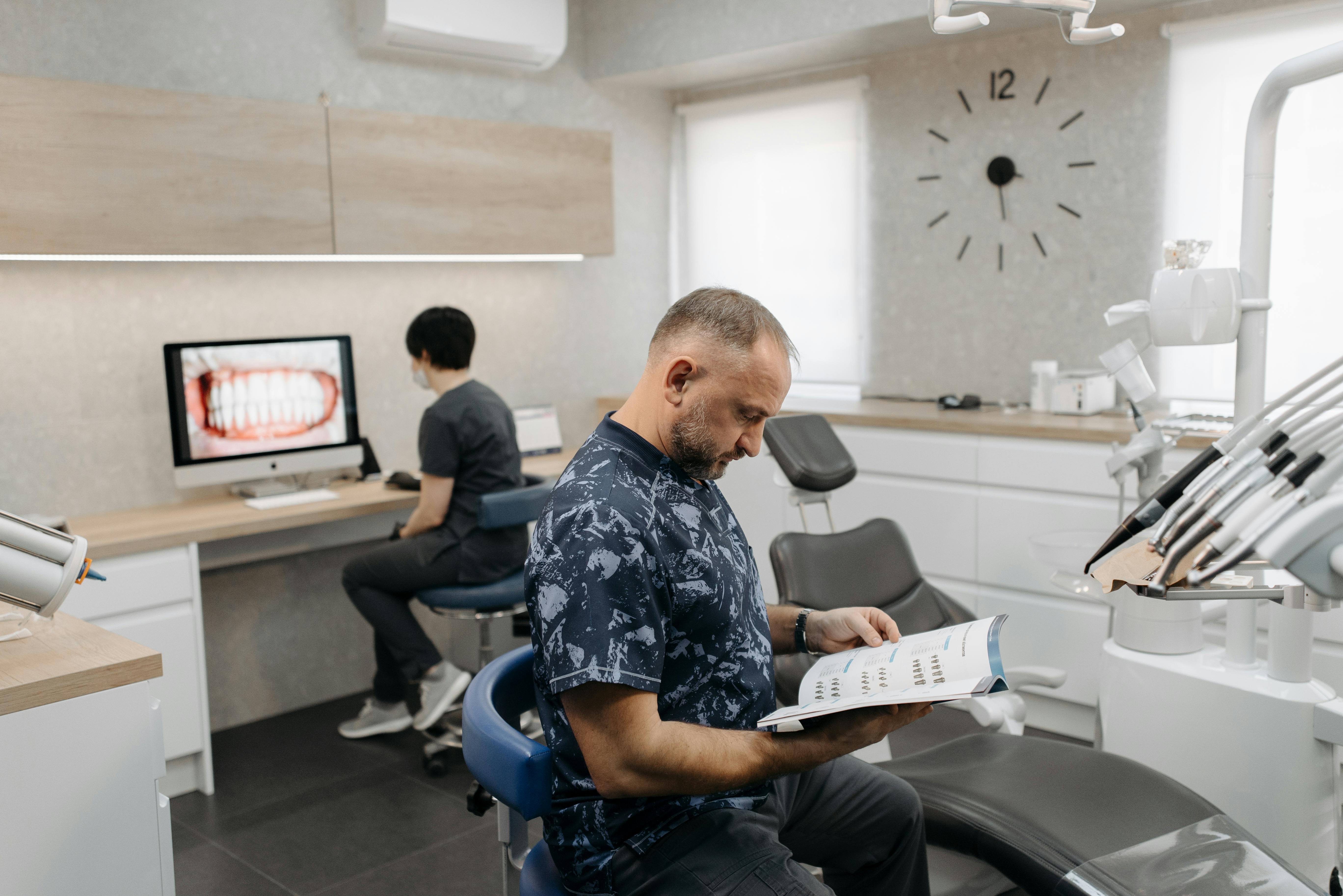 dentist reviewing paperwork