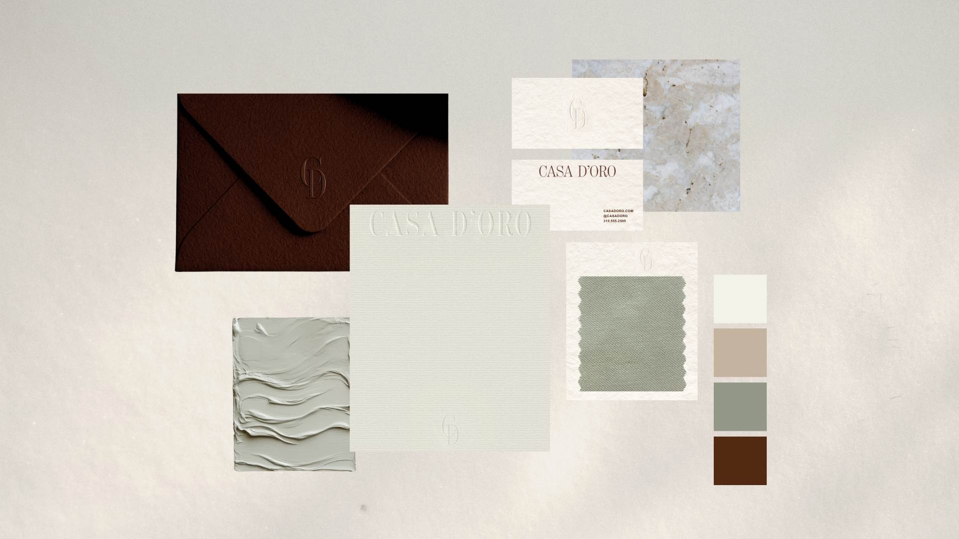 Casa D’Oro brand identity stationery set with textured papers, neutral color palette, and materials.