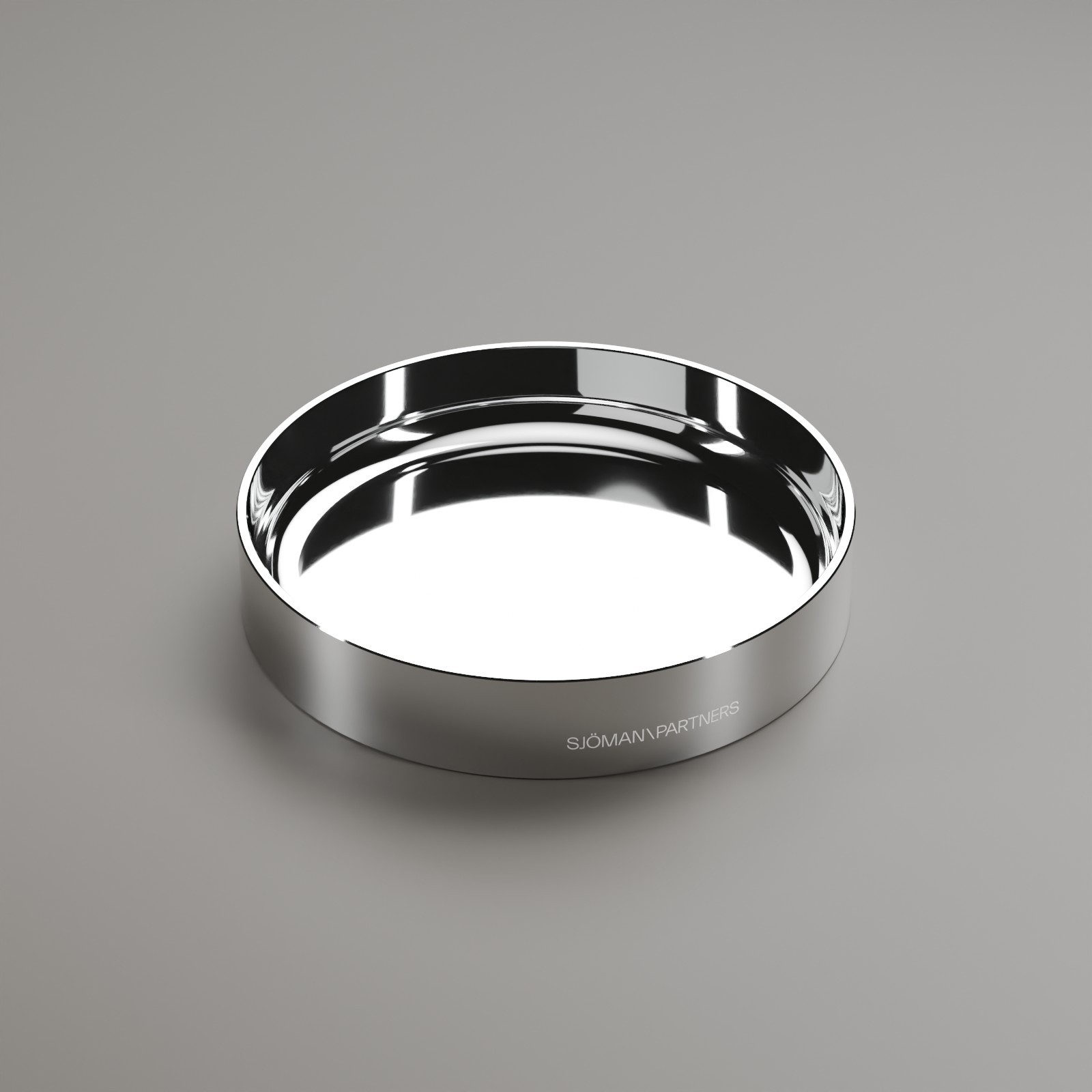 Circular metal tray with a reflective polished finish