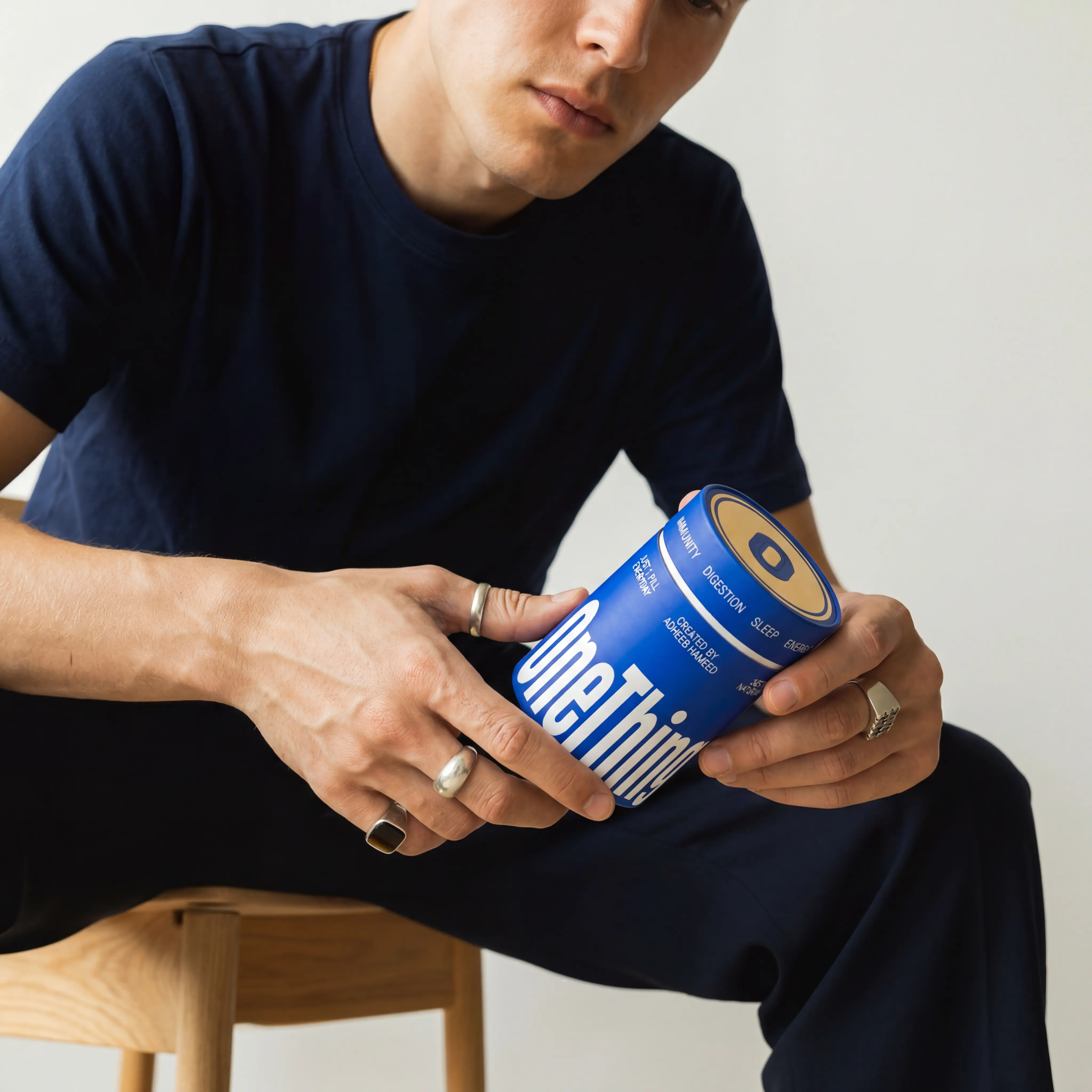 man holding a supplement box
